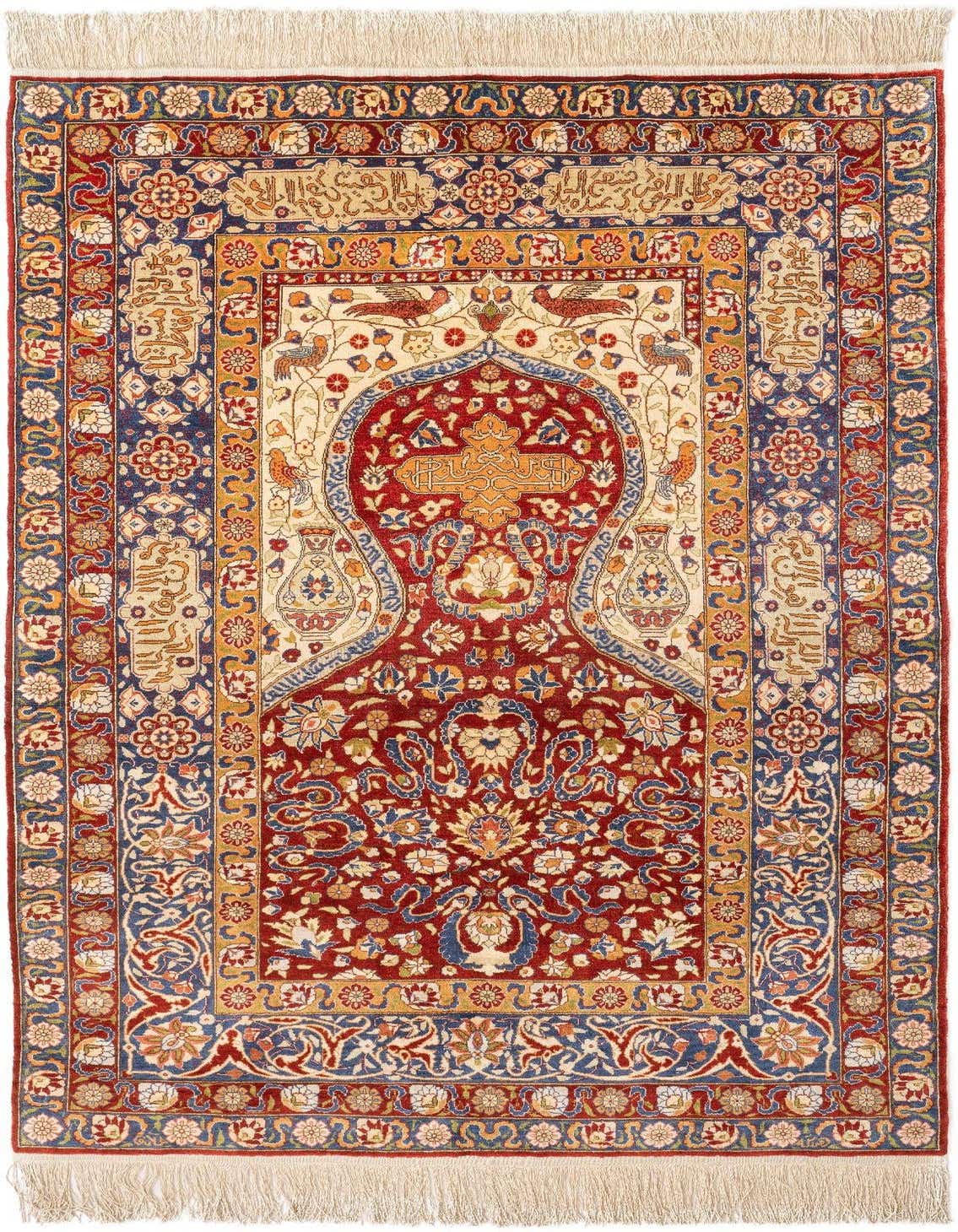 A handmade 4x6 rectangular Kayseri Silk rug featuring a rich red field with intricate floral and bird motifs, framed by blue and gold borders, suitable for a living room.