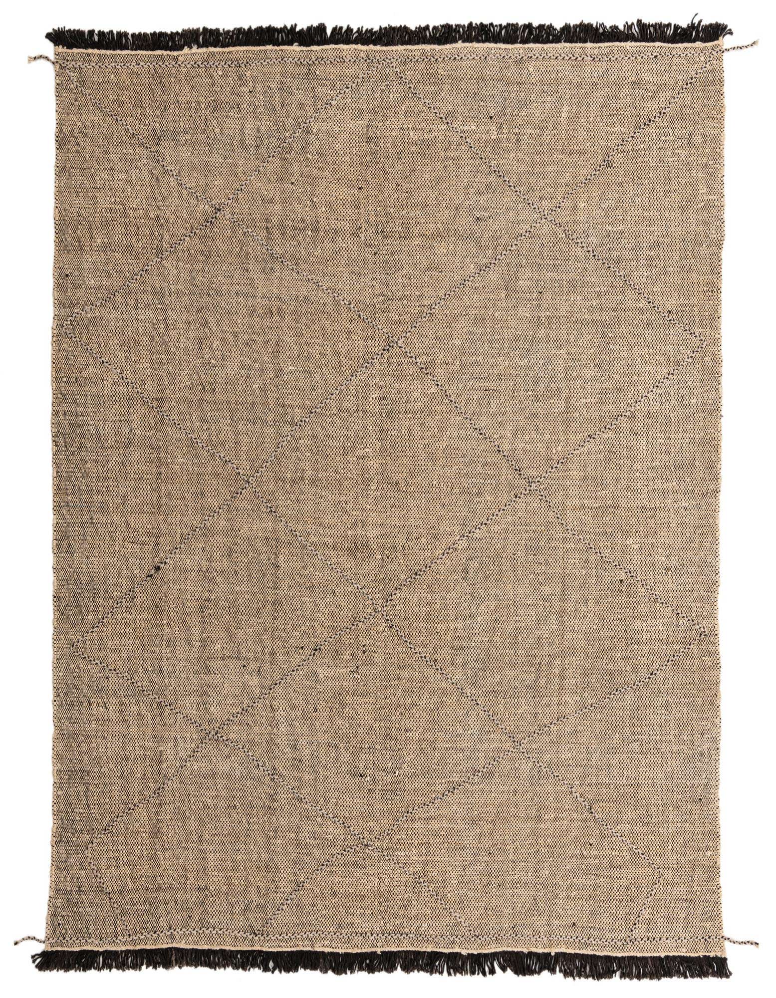 A rectangular 8x10 natural wool shag rug with a subtle tribal diamond pattern and dark fringed edges.