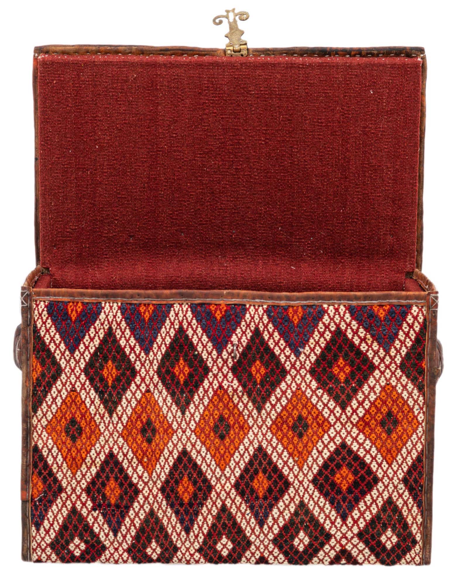 An open rectangular box with a lid, featuring a traditional Oriental diamond pattern in oranges, reds, and blues on the exterior, and a solid red fabric lining inside.