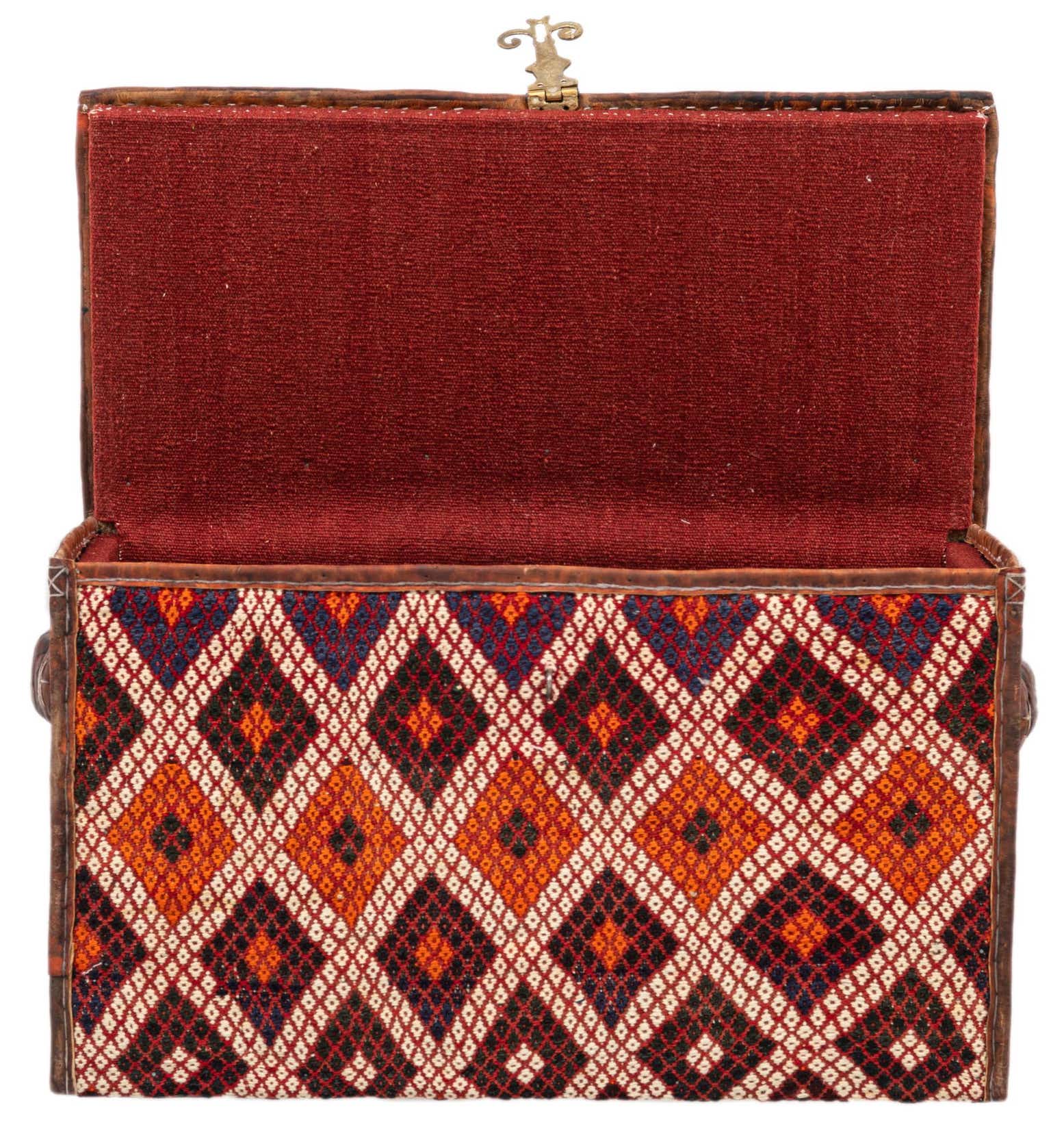 An open rectangular box with a lid, featuring a traditional Oriental diamond pattern in oranges, reds, and blues on the exterior, and a solid red fabric lining inside.