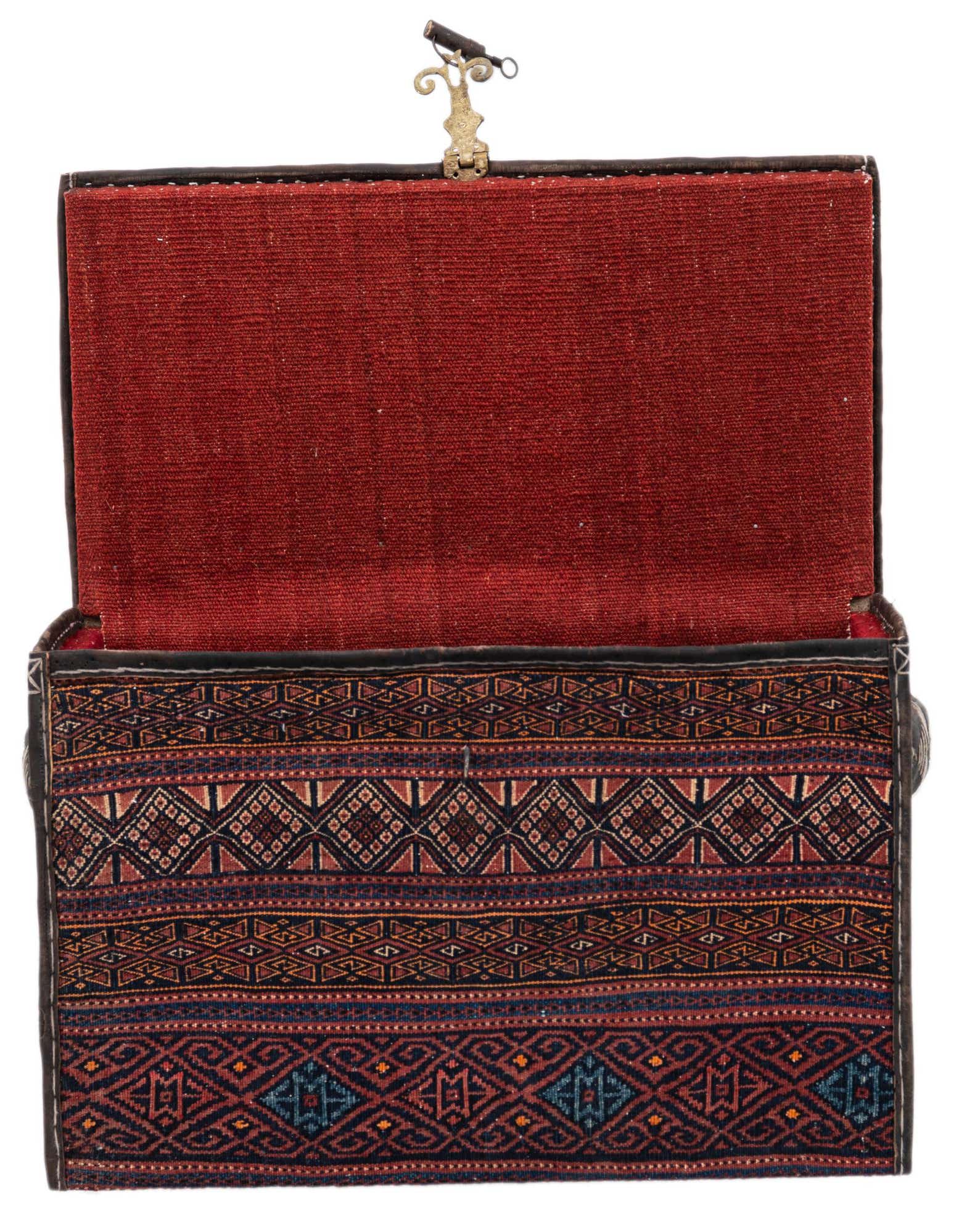 An open 1x2 rectangular rug box with a traditional Oriental pattern in oranges, reds, and blues, featuring a red fabric interior.