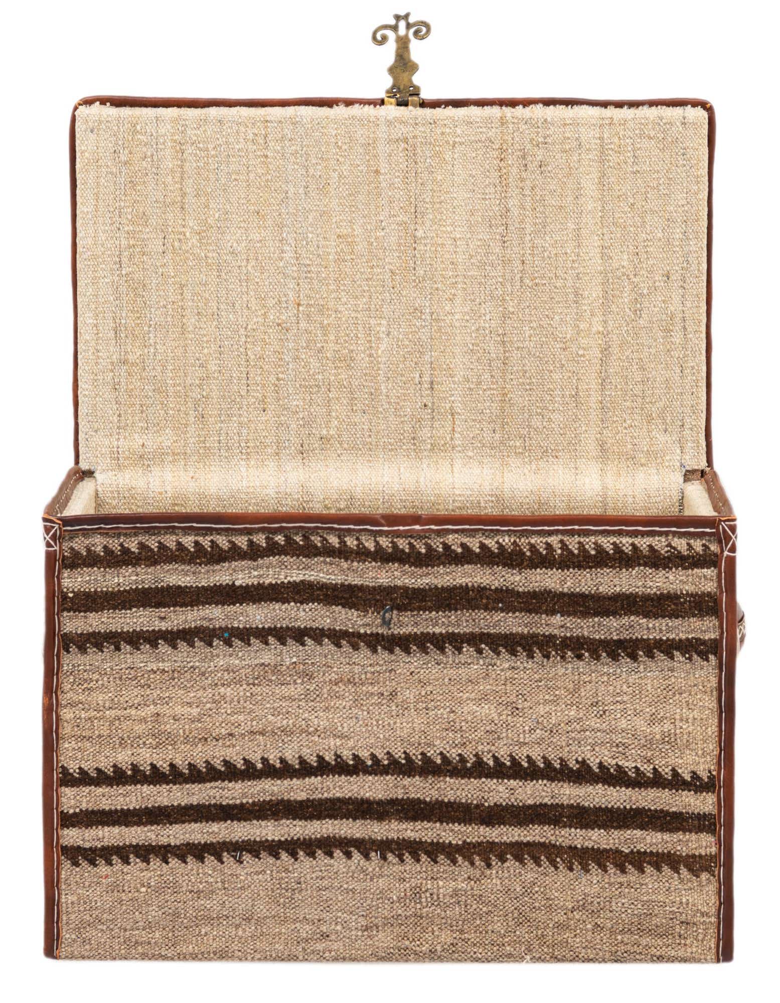 A rectangular, handmade storage trunk with an open lid, featuring a textured tan and brown striped pattern, trimmed with brown leather.