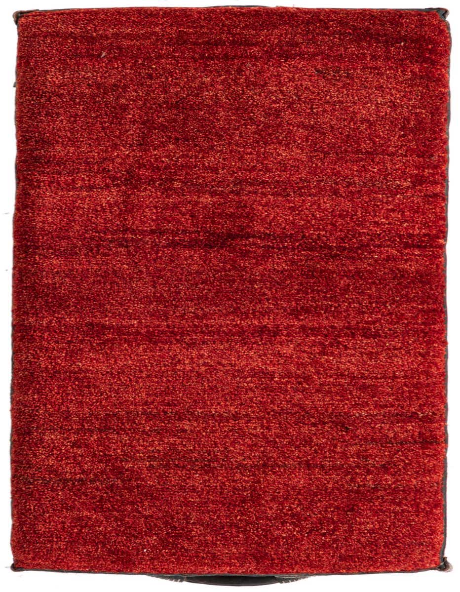 A vibrant 2x3 rectangular rug in shades of orange and red, featuring a textured, handmade pile.