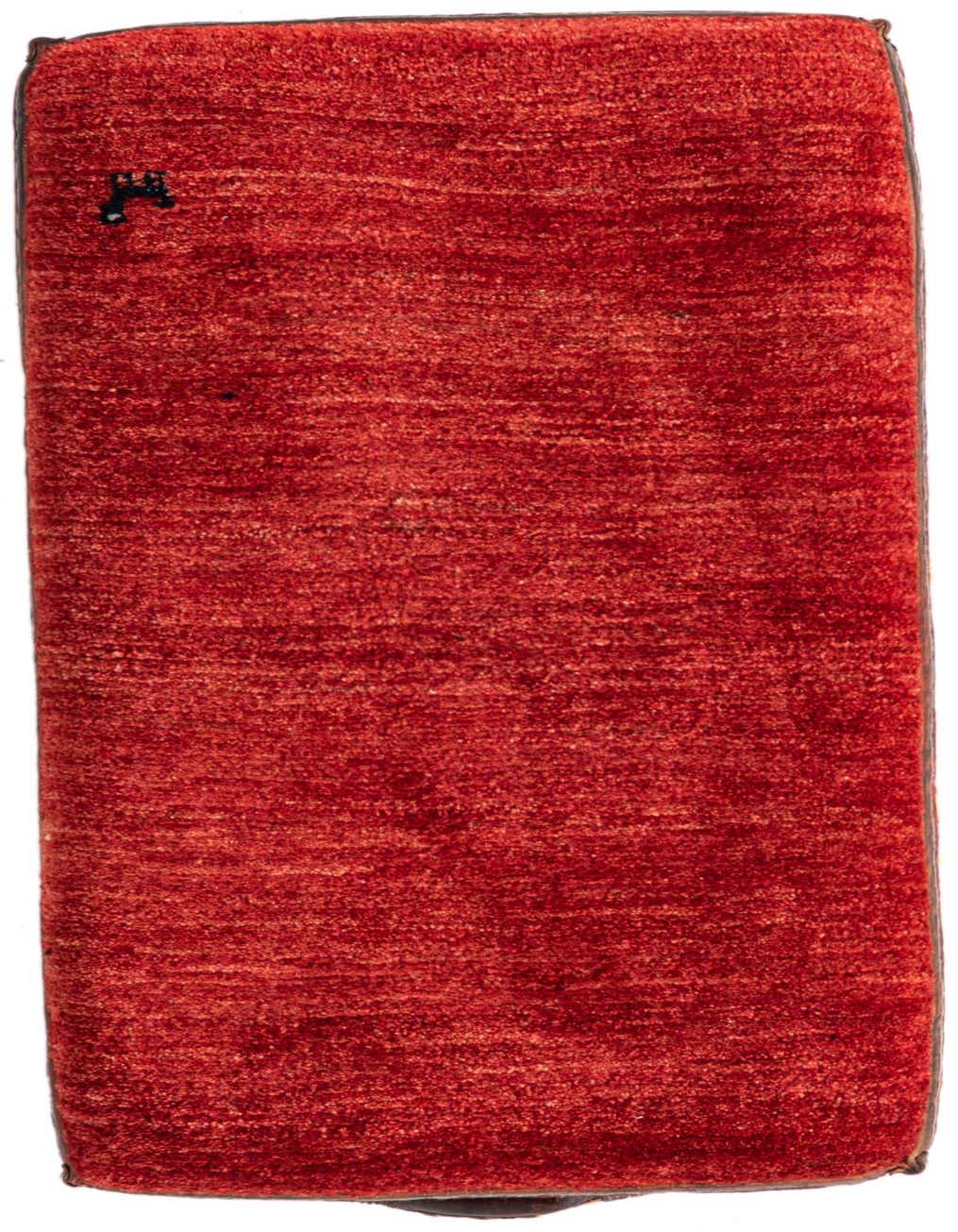 A 2x3 rectangular indoor rug in vibrant orange and red hues with a subtle textured, traditional pattern.