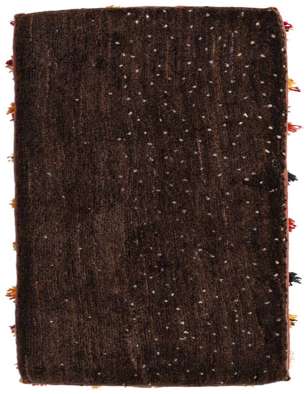 A 2x3 rectangular brown traditional rug with subtle light speckles and colorful tassels along the short edges, showcasing its textured pile.