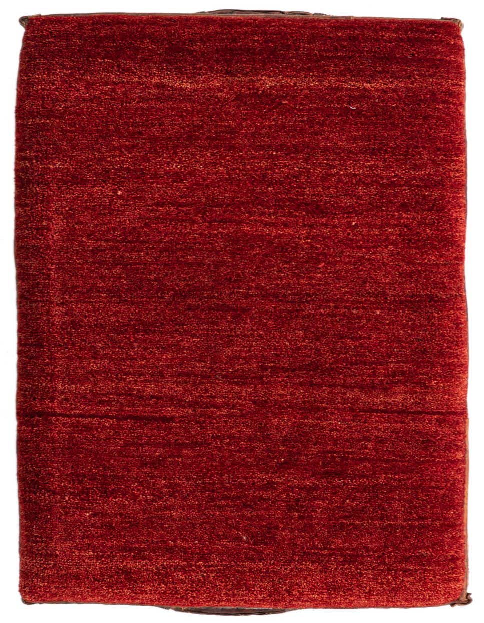 A 2x3 rectangular indoor rug in vibrant orange and red hues, featuring a textured, traditional pile.