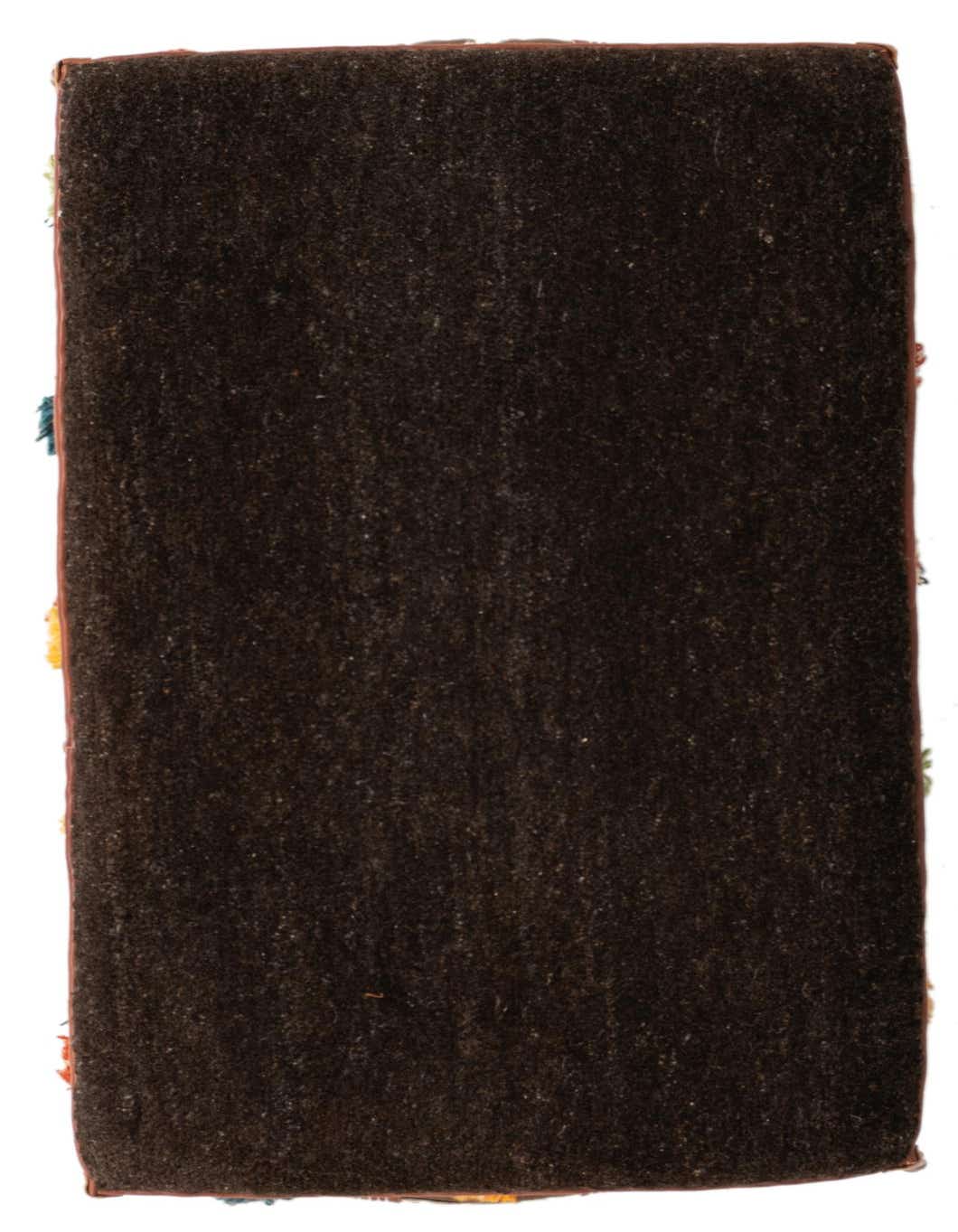 A close-up view of a dark brown rectangular rug with a medium pile, showing its textured surface and subtle variations in tone.