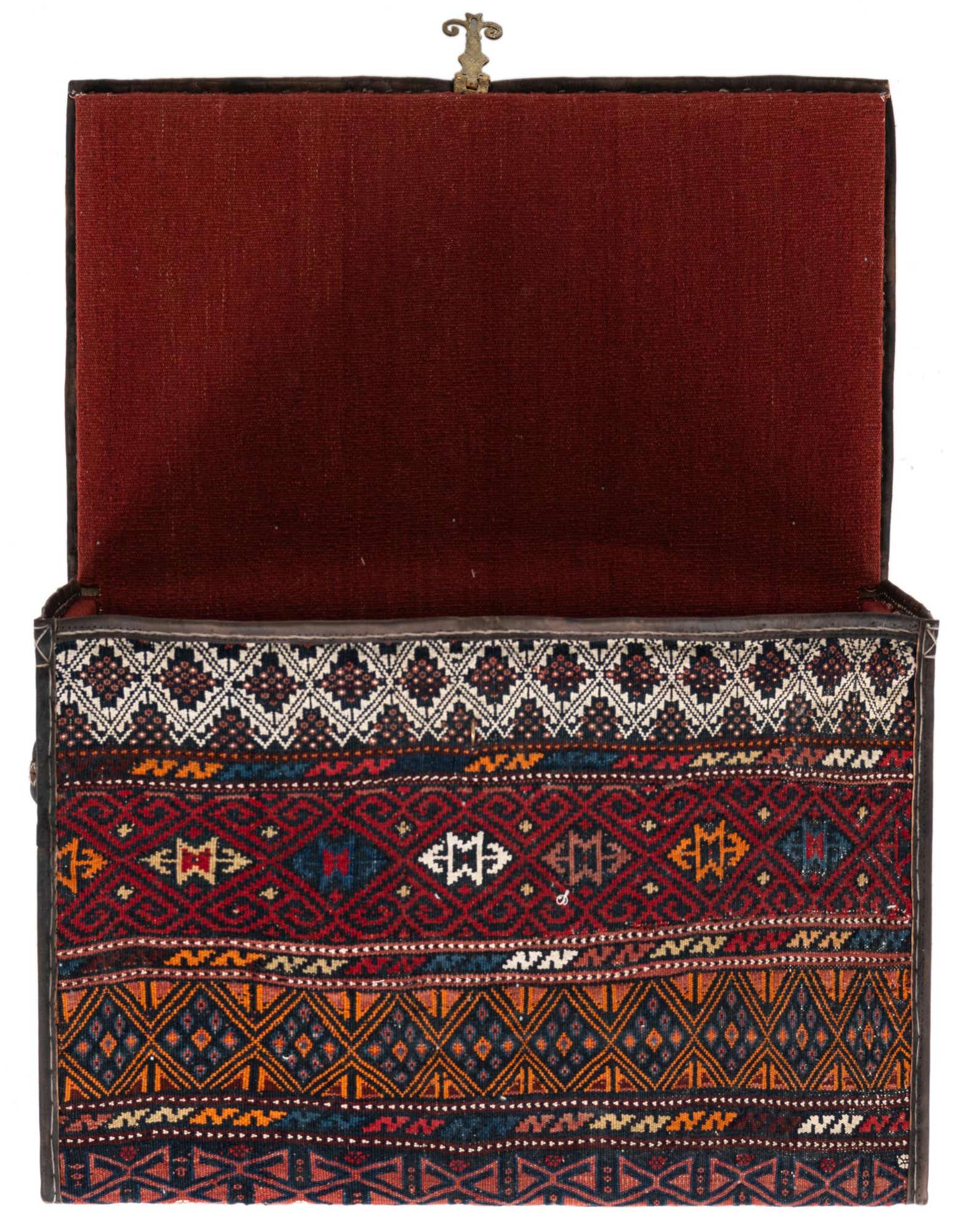 A rectangular 2x3 rug featuring a modern abstract pattern in oranges, reds, and blues, with a medium pile.