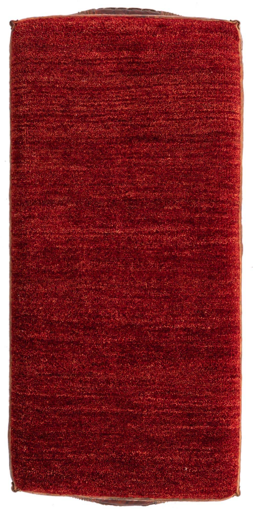 A 2x3 rectangular indoor rug in vibrant orange and red hues with a textured, traditional pile.