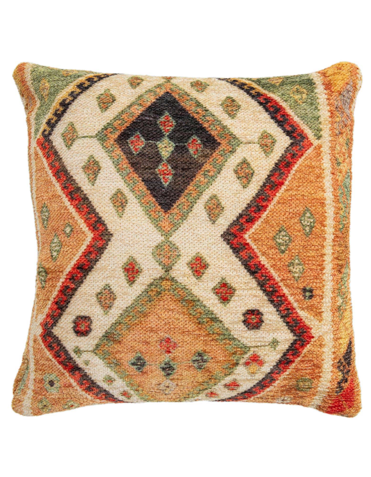 A rectangular throw pillow featuring a multi-colored modern geometric pattern with diamonds in orange, green, red, and black on a cream background.