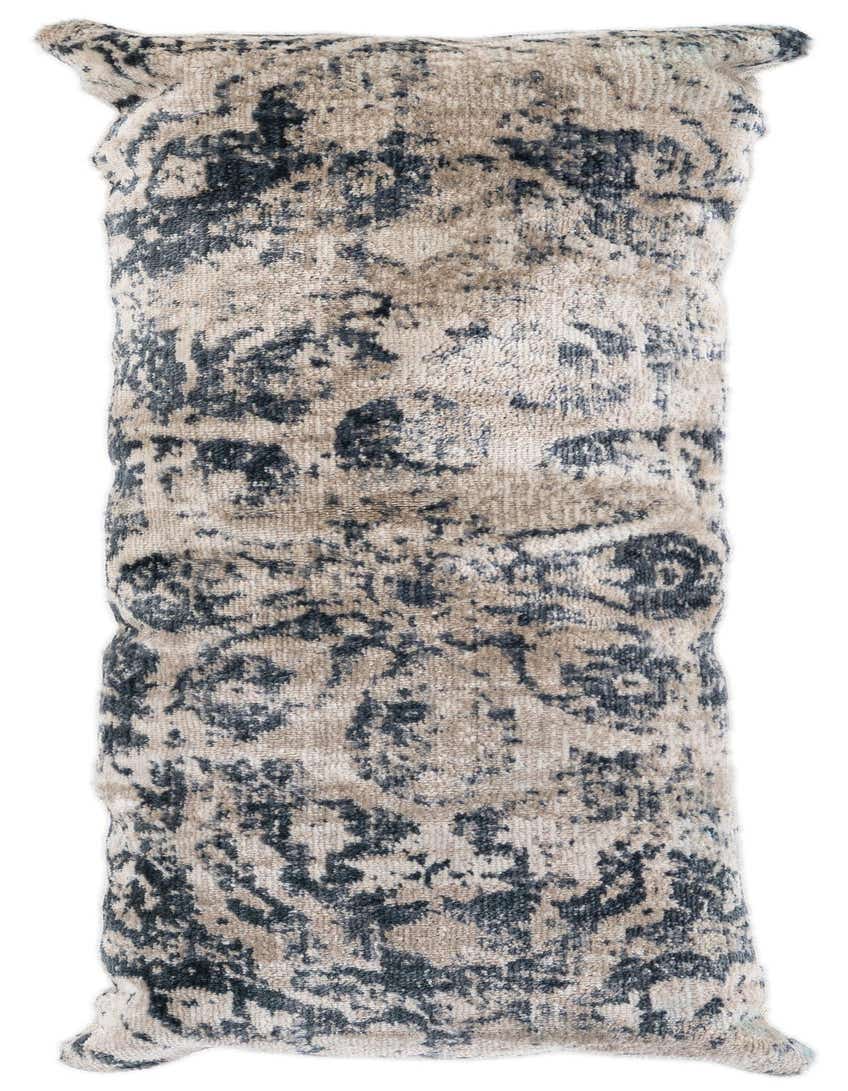 A rectangular gray and beige vintage oriental pillow with a medium pile, rolled up for display.