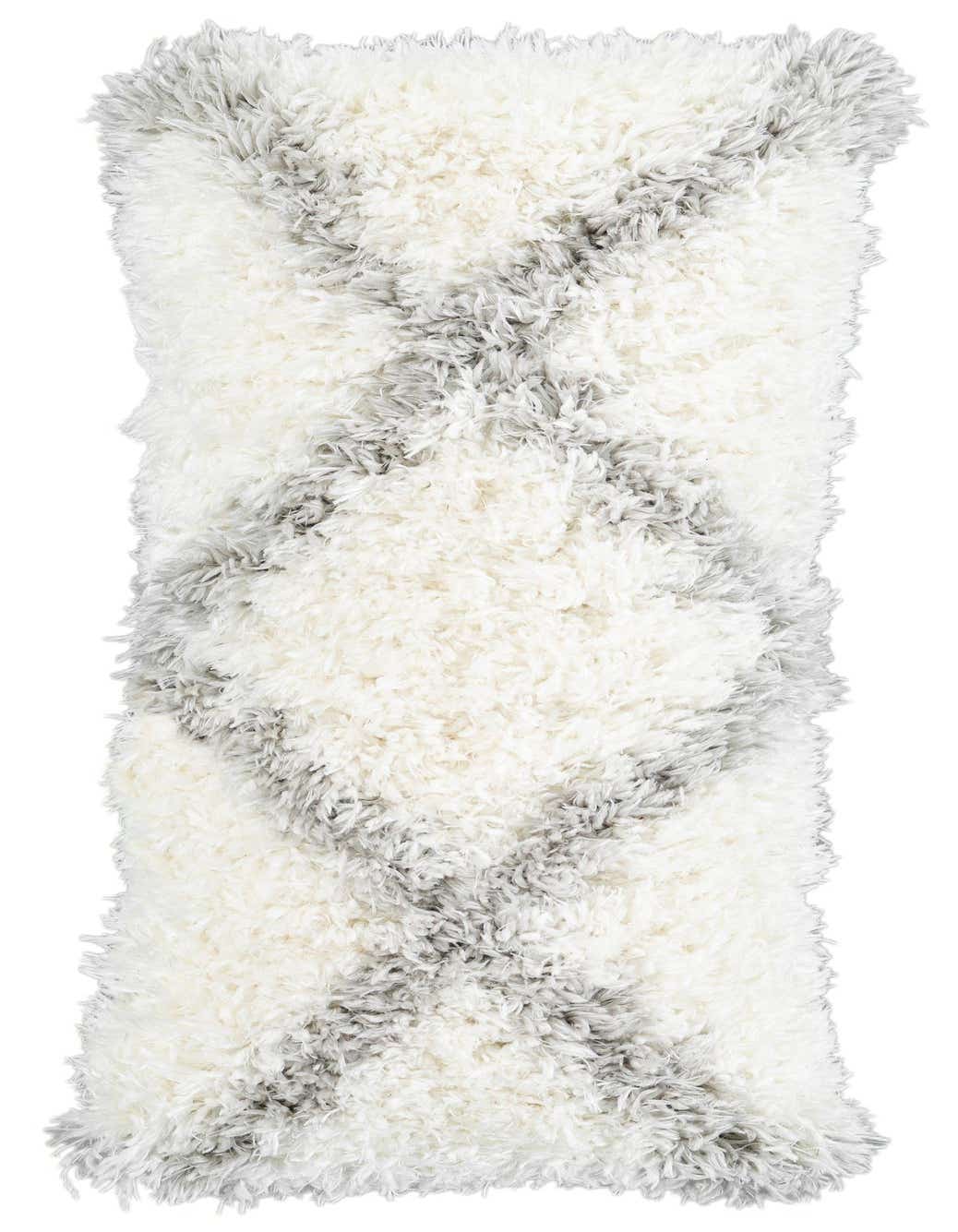 A plush rectangular rug with a shaggy texture, featuring an ivory and cream base with a distressed gray medallion pattern.