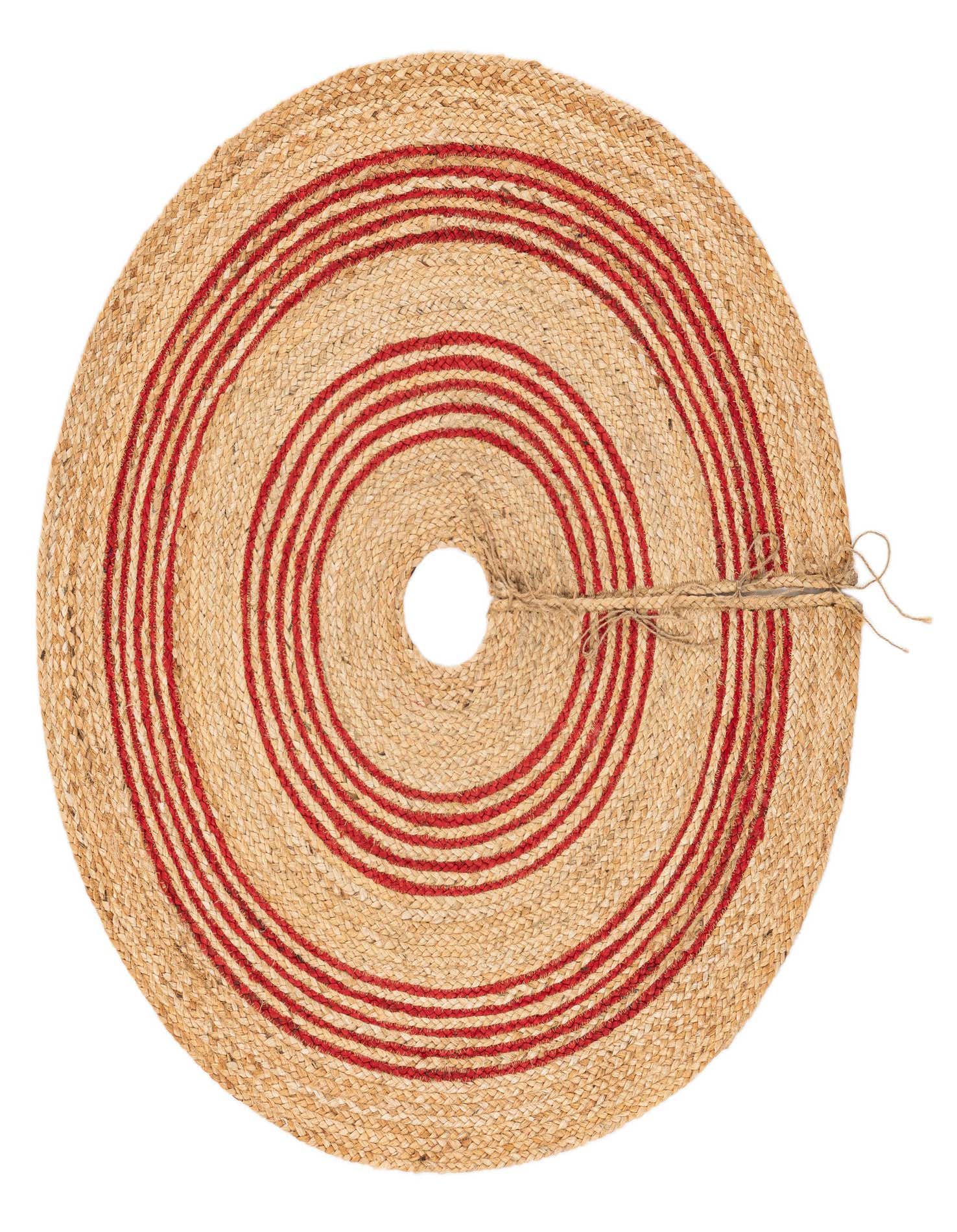 A round, braided jute Christmas tree skirt with a natural tan color and concentric red stripes, featuring a center opening and tie closure.