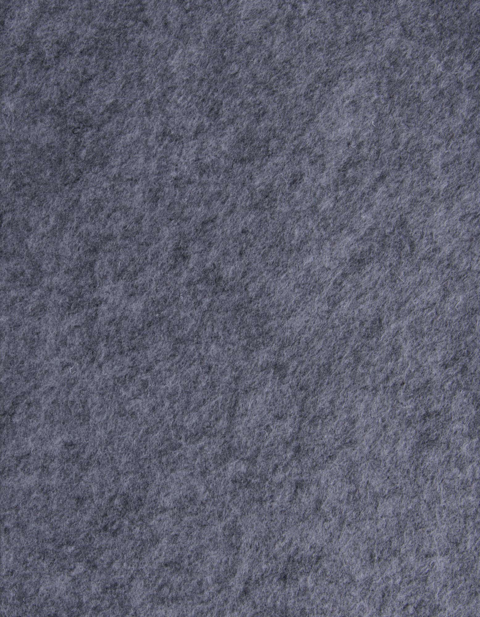 Close-up of a medium pile, solid gray square rug, showcasing its soft texture and uniform color.