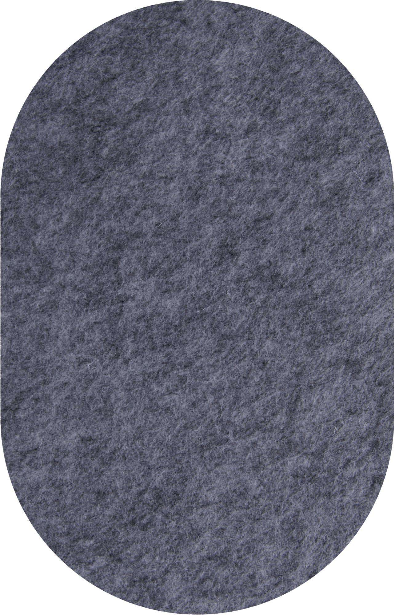 A medium pile oval rug in a solid dark gray or charcoal color, suitable for an indoor patio.