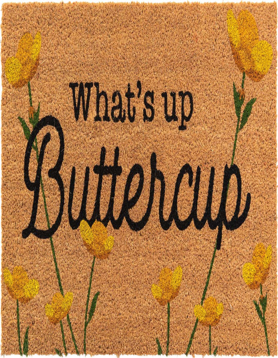 A rectangular brown coir doormat with "What's up Buttercup" in black script, surrounded by yellow buttercup flowers.