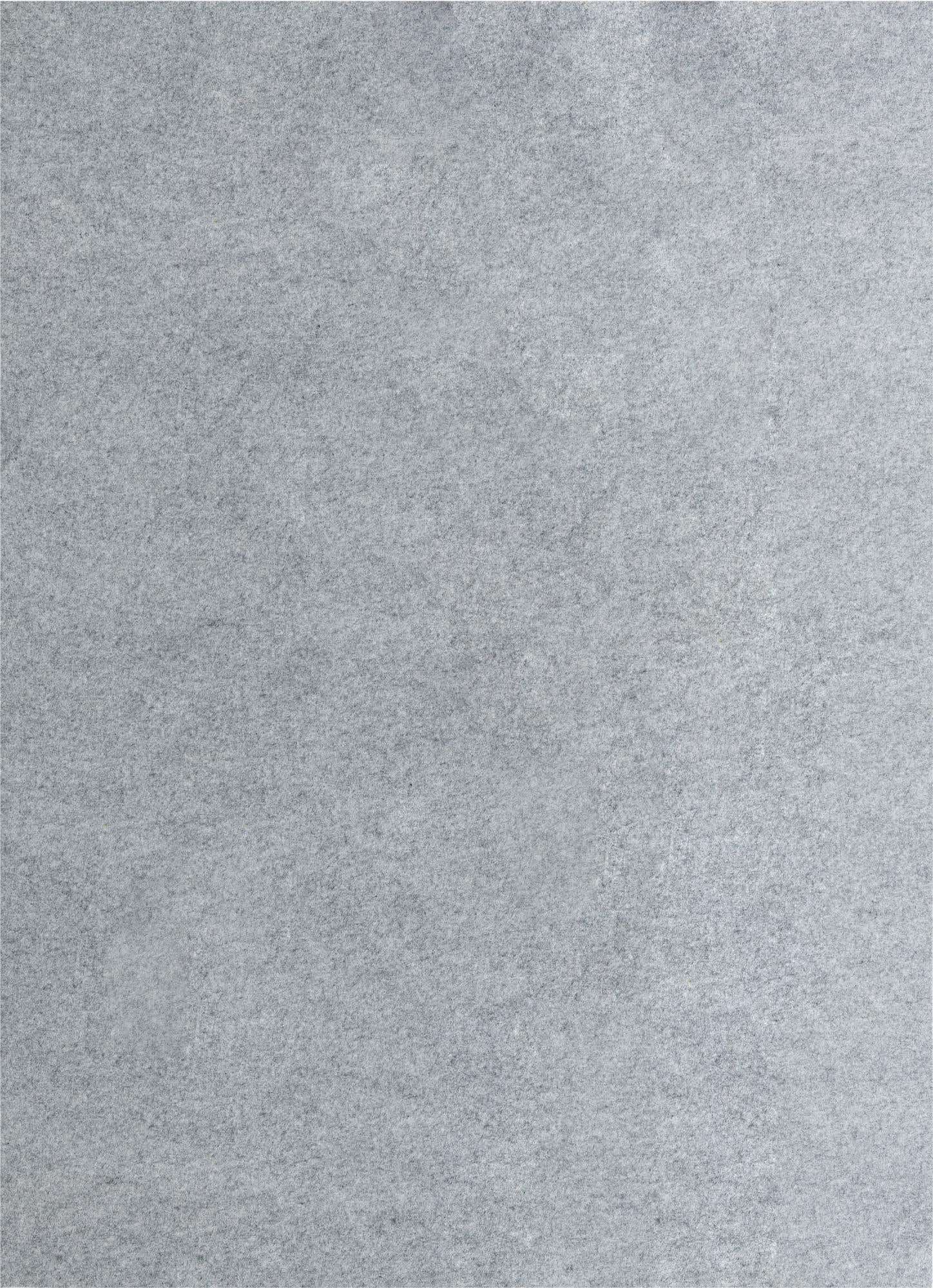 A close-up view of a medium gray rectangular rug pad, showing its textured, felt-like surface.