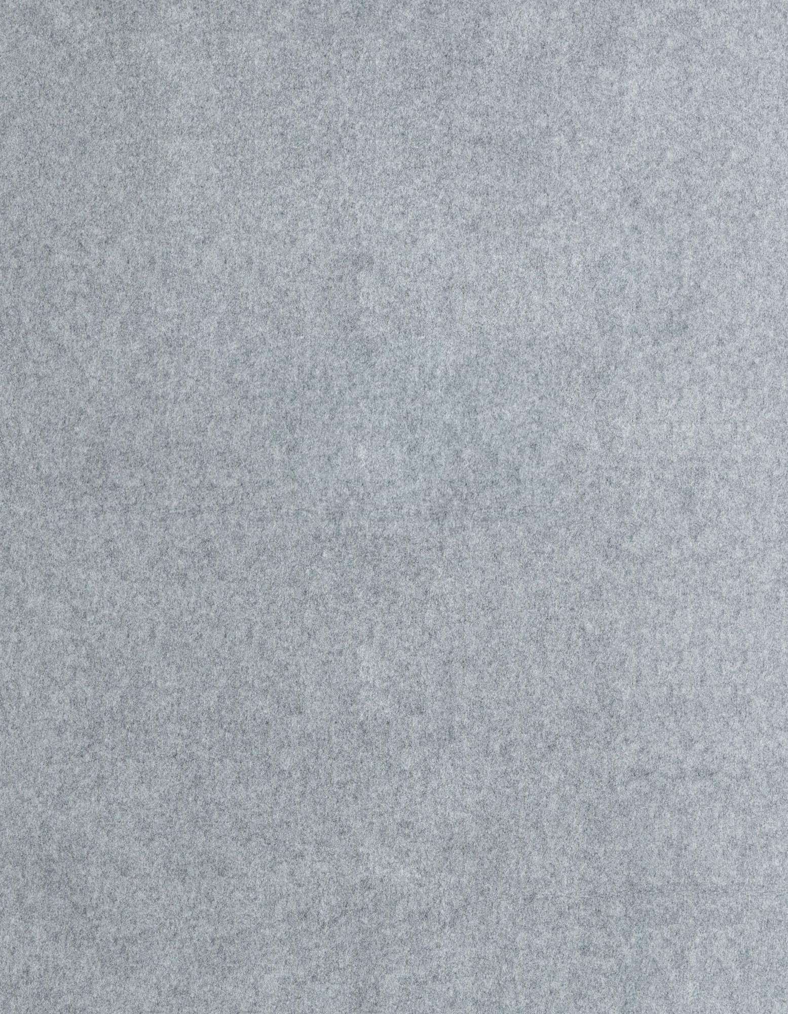 A close-up, top-down view of a medium pile, solid light gray square rug pad, showing its soft, uniform texture.