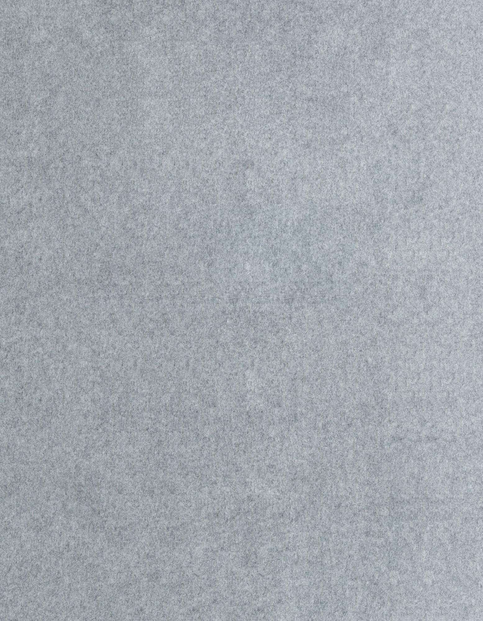 Close-up view of a medium gray square rug with a subtle, textured appearance, suitable for indoor use.
