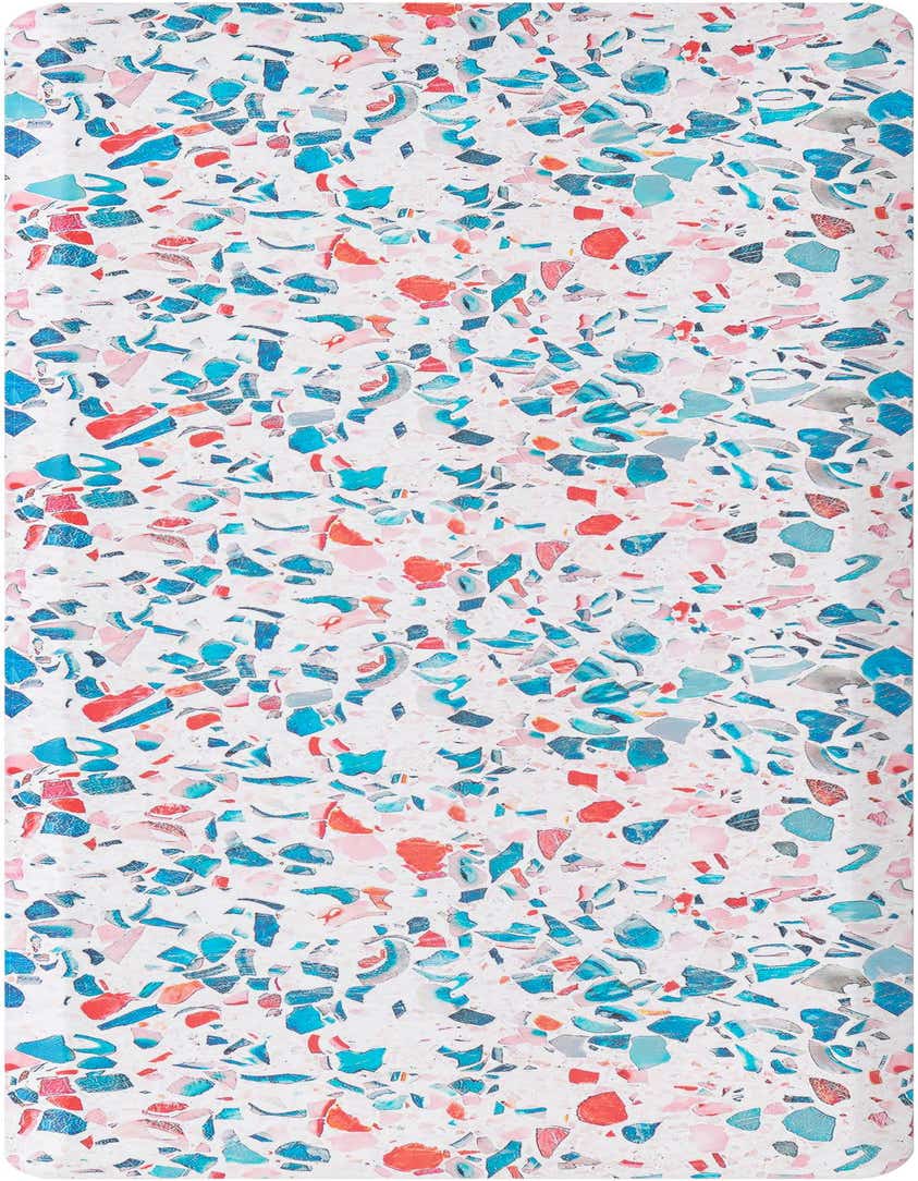 A rectangular 2x5 multi-colored rug with a vibrant terrazzo-like pattern featuring various shades of blue, pink, red, and grey chips on a white background.