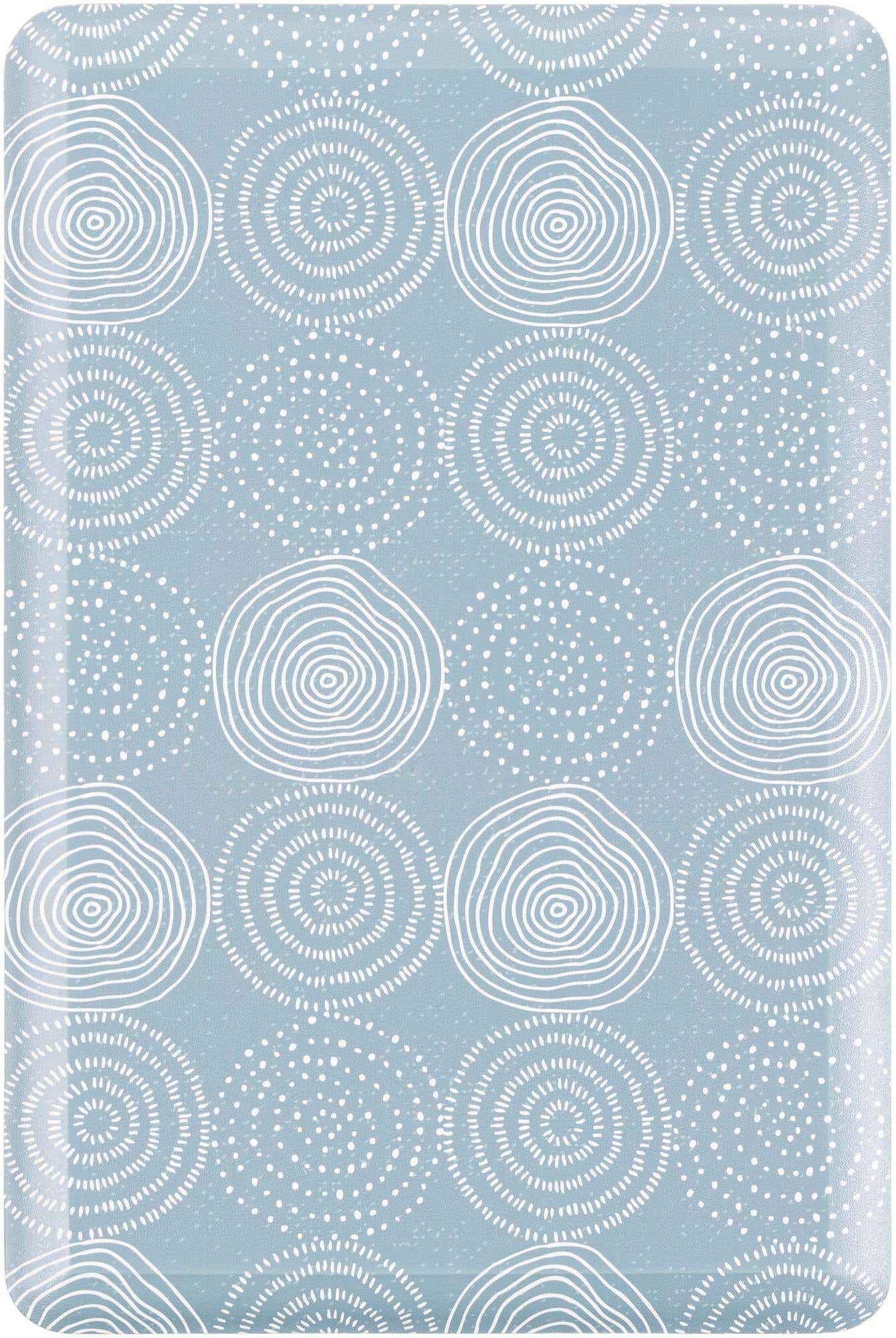 A 2x3 rectangular blue Comfort Mat rug with a modern abstract pattern of white concentric circles and dotted patterns.