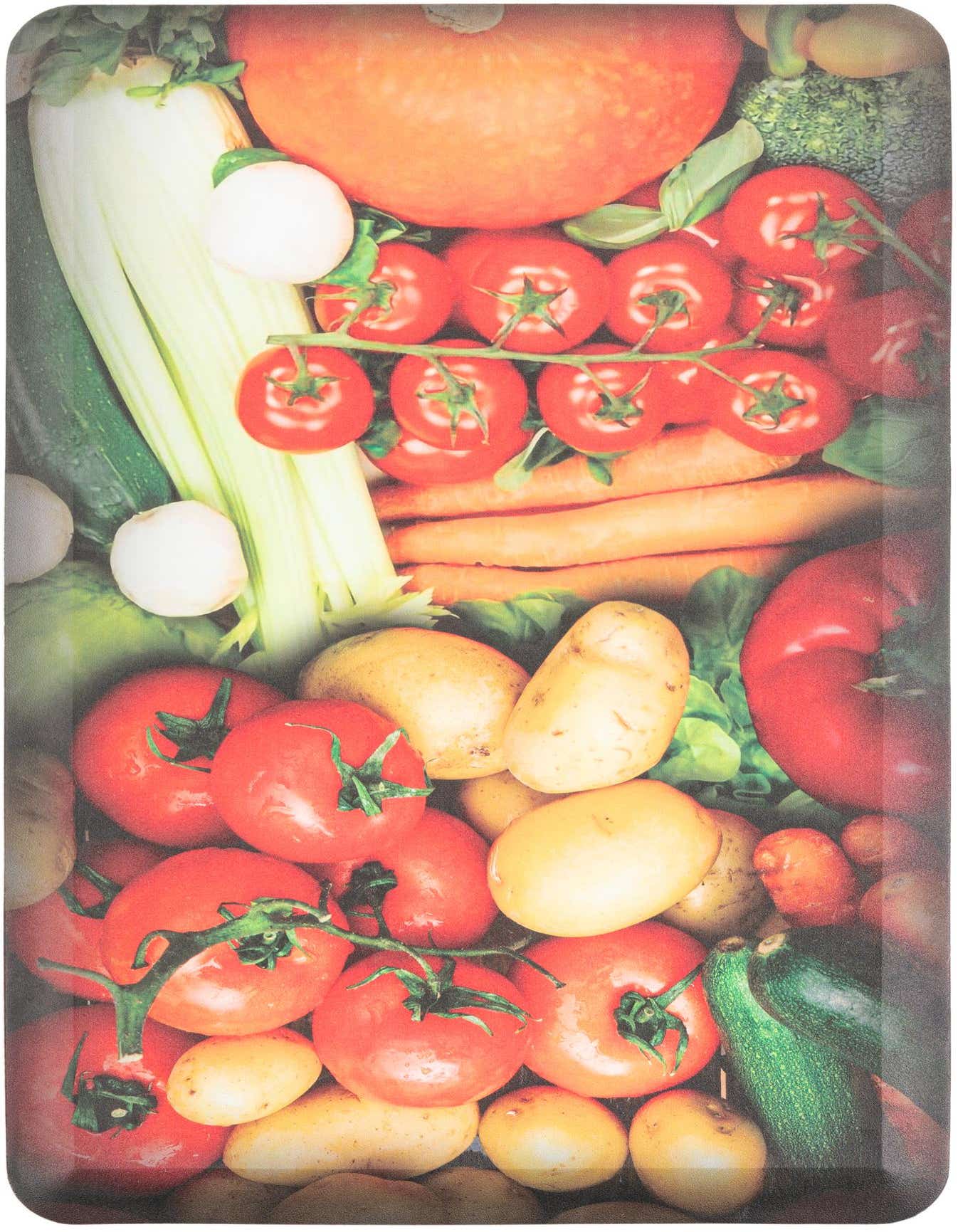 A vibrant 2x3 rectangular Comfort Mat rug featuring a detailed, multi-colored print of fresh vegetables including tomatoes, potatoes, carrots, celery, and zucchini.