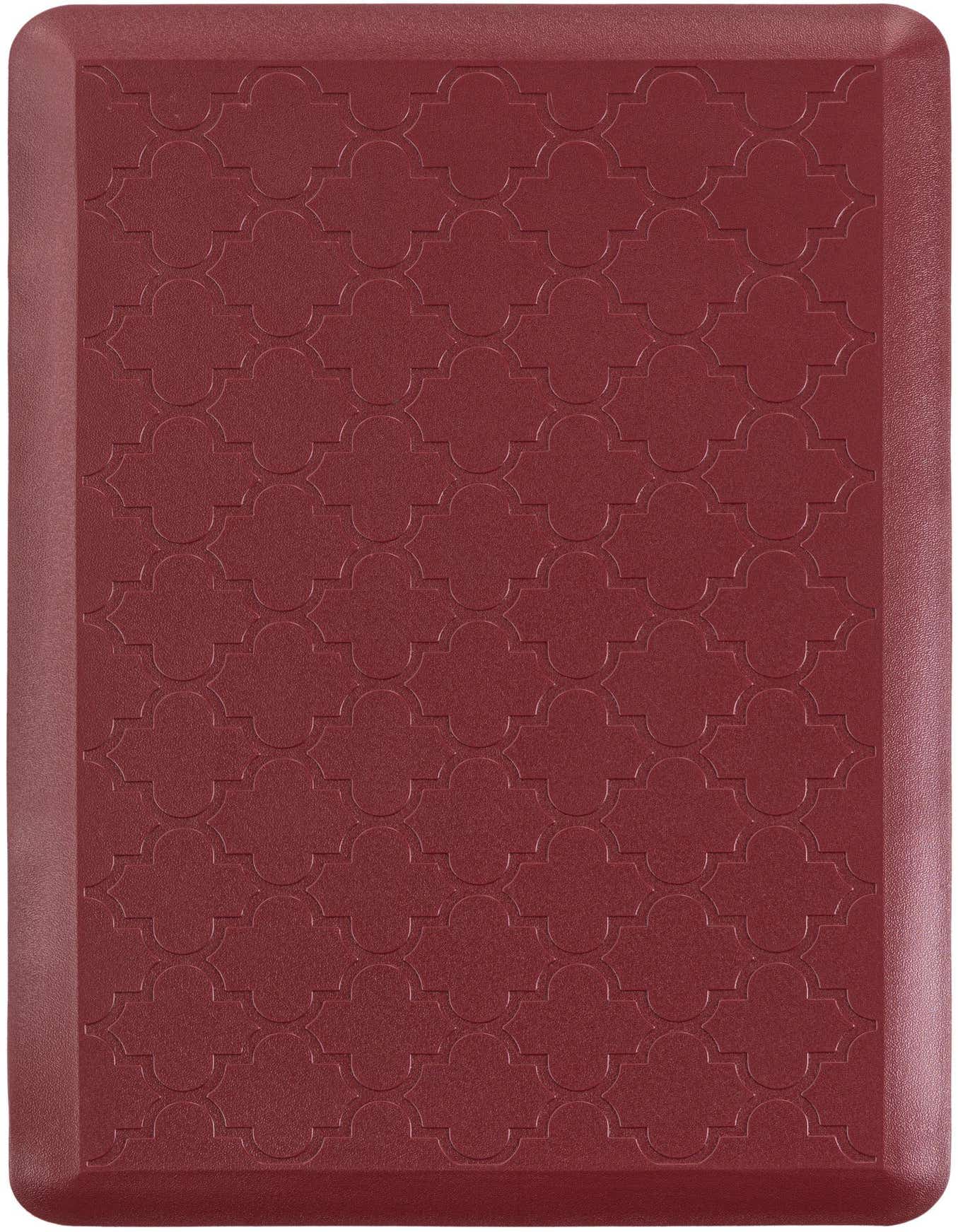 A 2x3 rectangular red comfort mat with a subtle embossed quatrefoil pattern and rounded edges, ideal for indoor use.