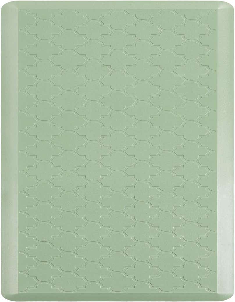 A rectangular 2x5 green comfort mat with an embossed quatrefoil pattern, ideal for indoor use.