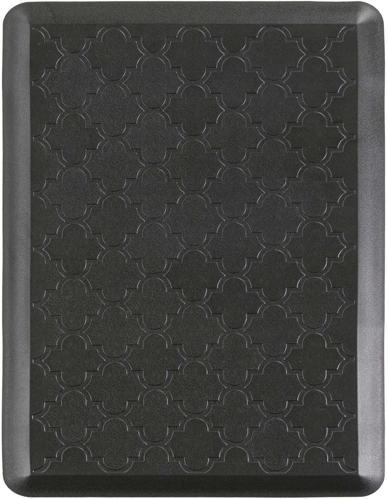 A 2x3 rectangular black comfort mat with a subtle embossed quatrefoil pattern and a slightly raised border.
