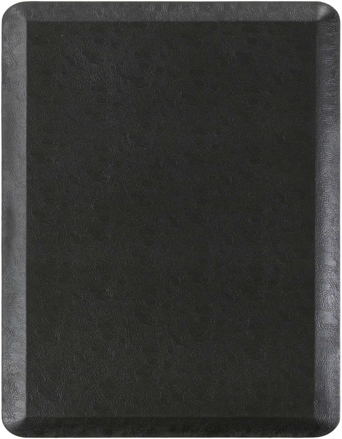 A 2x3 rectangular black Comfort Mat from Rugs.com, featuring a textured surface and slightly raised edges.