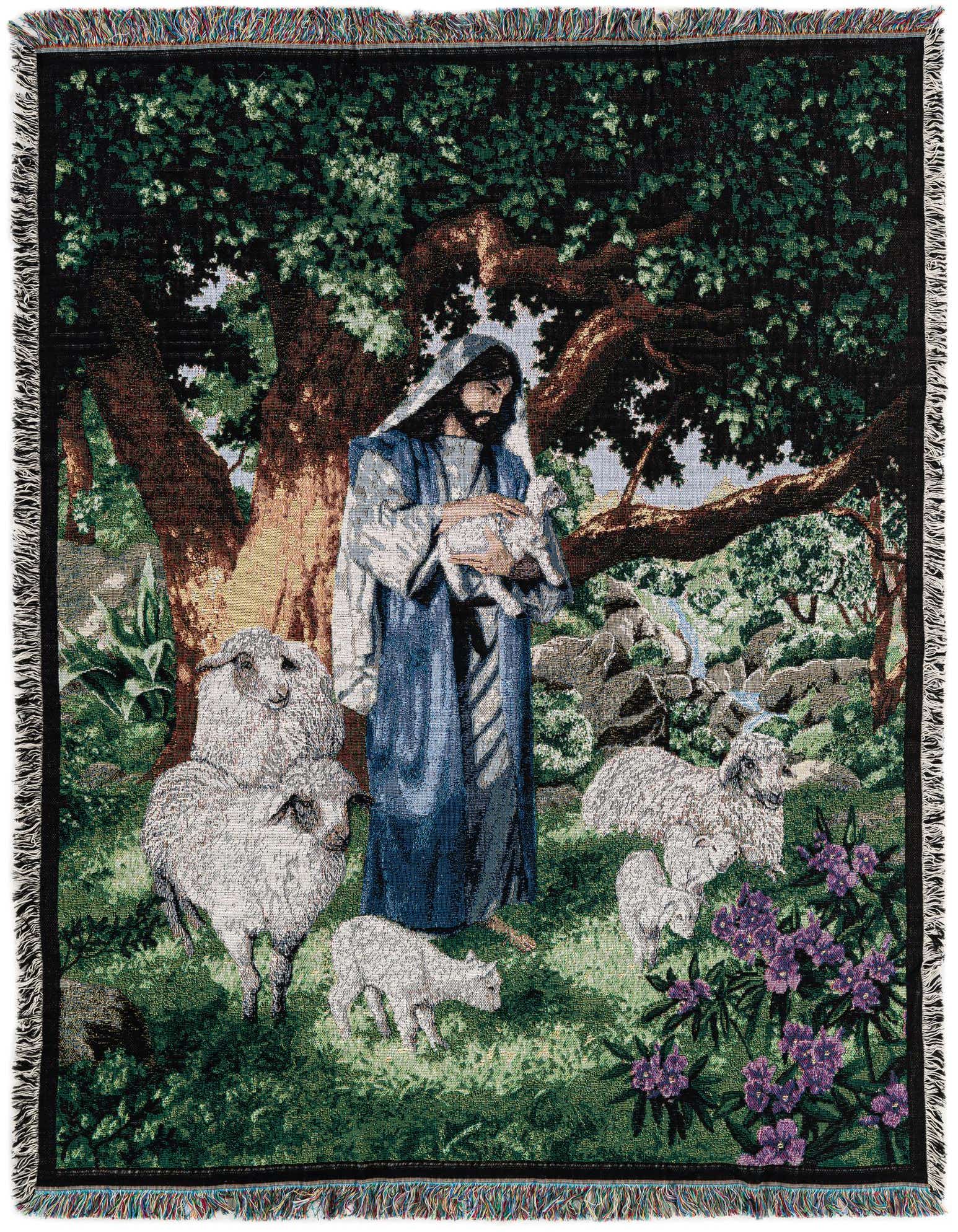 A rectangular 4x6 green medallion throw blanket depicting Jesus holding a lamb surrounded by sheep and trees.