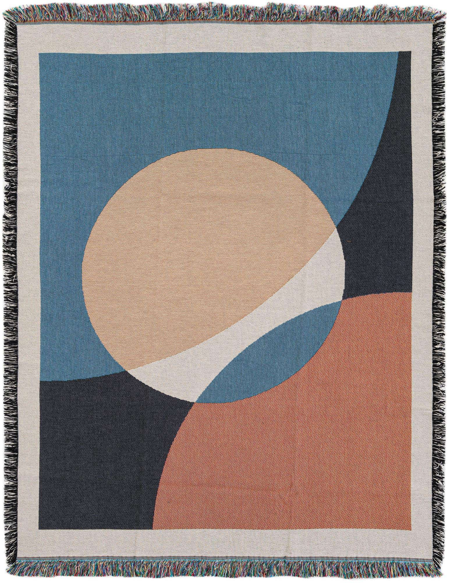 A 4x6 multi-colored abstract cotton throw blanket with a modern geometric design in blue, peach, white, and dark gray, featuring fringe edges.