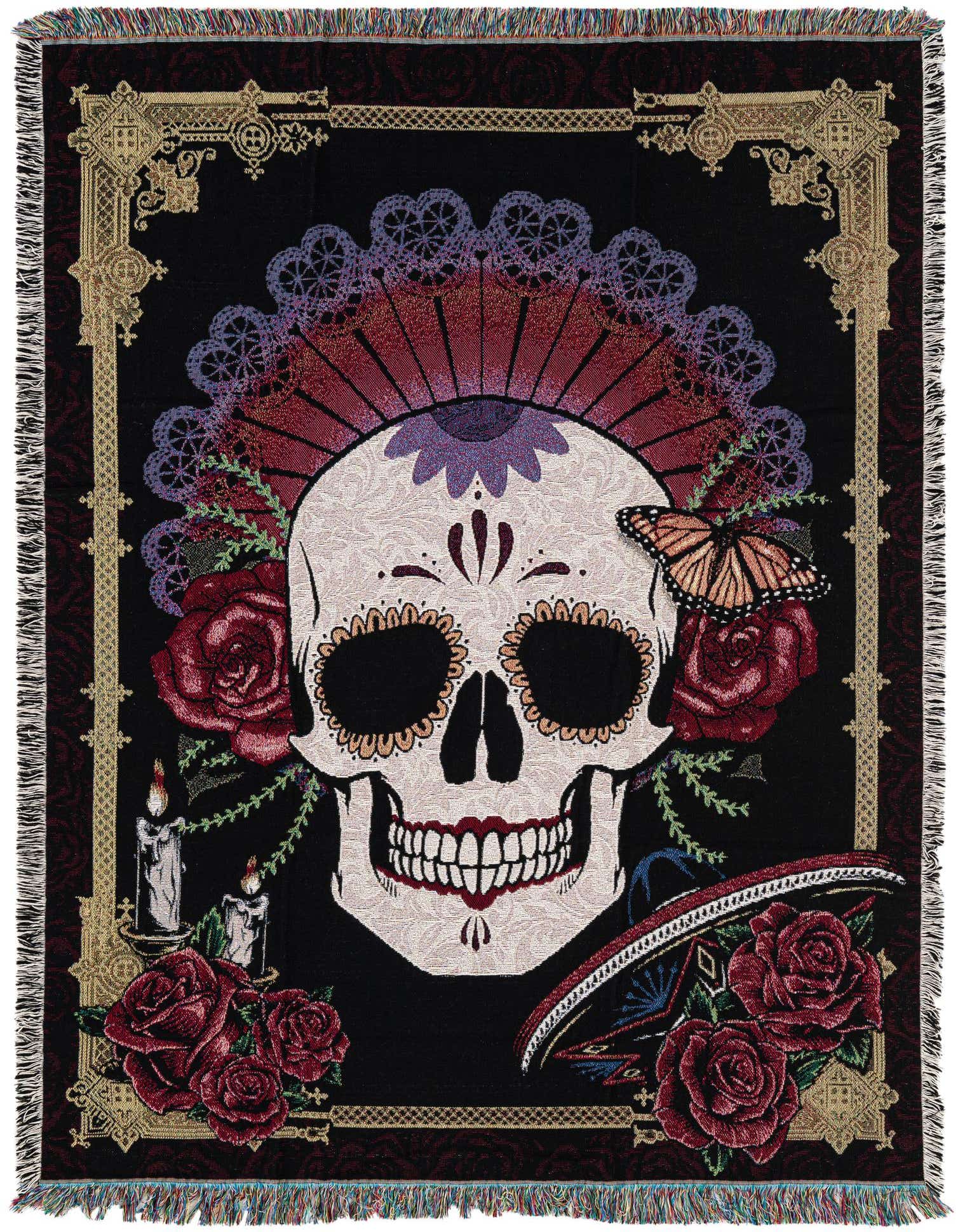 A rectangular 4x6 multi-colored cotton throw blanket featuring a large, ornate sugar skull design with roses, candles, and a butterfly on a black background, framed by a gold border.