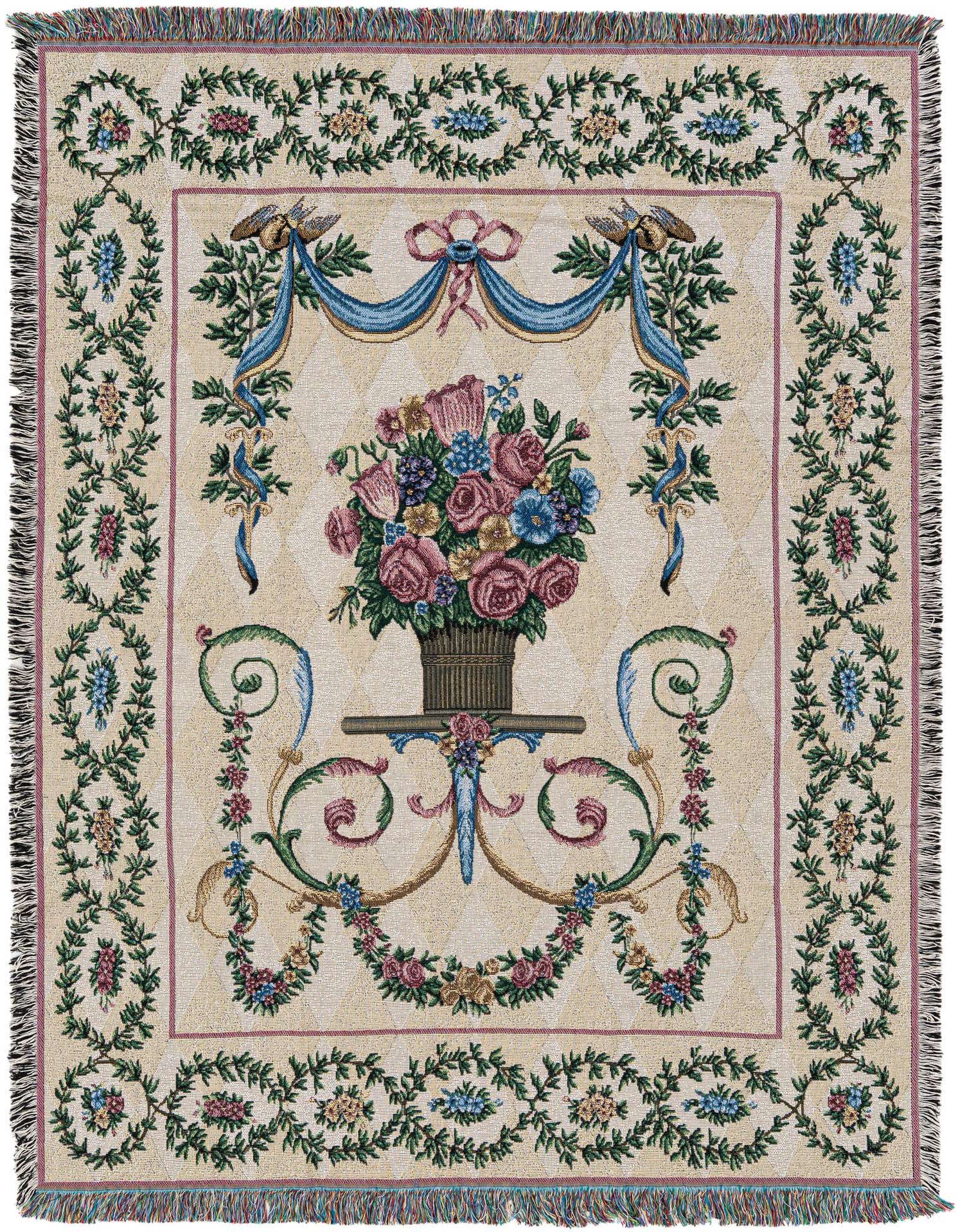 A rectangular 4x6 multi-colored cotton throw blanket featuring a central floral bouquet in a vase, framed by ornate blue ribbons, with a decorative floral border on a cream background.