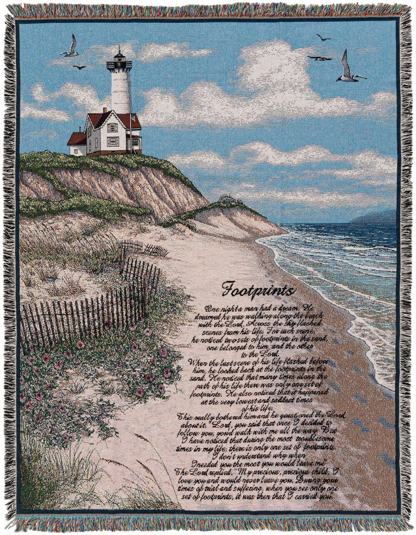 A rectangular throw blanket featuring a serene beach scene with a lighthouse on a cliff, seagulls, and the 'Footprints in the Sand' poem.