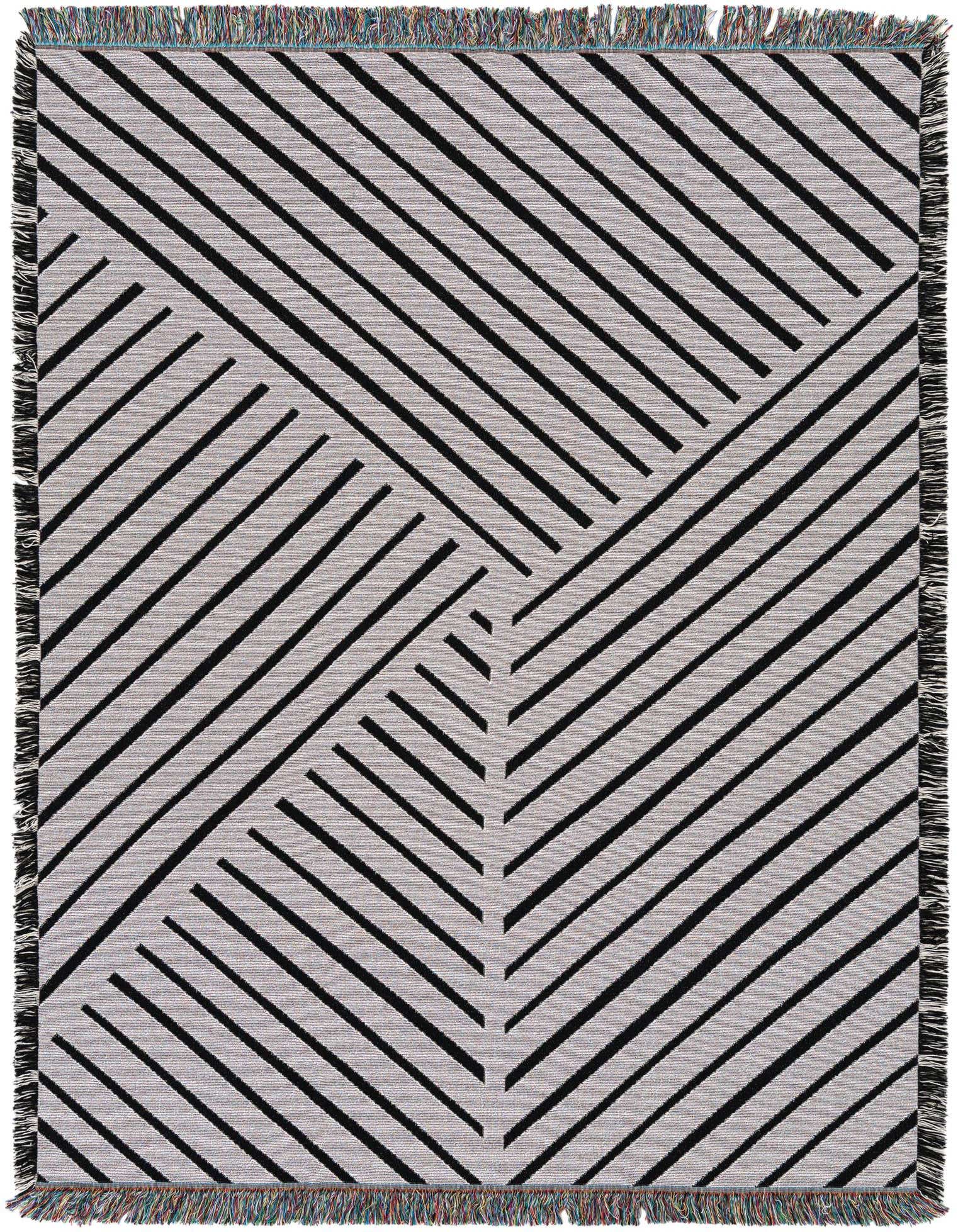A 4x6 rectangular black and white modern rug with a geometric striped pattern and fringed edges.