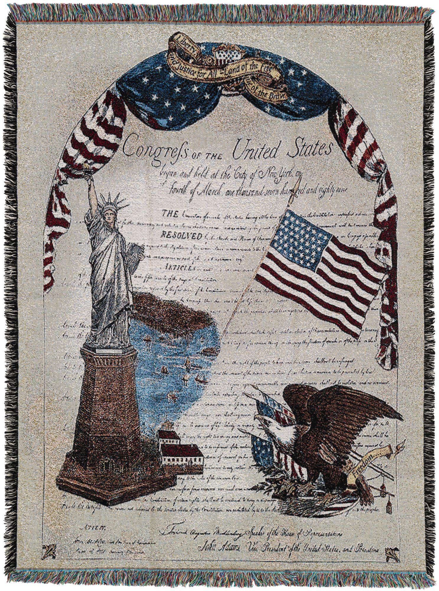 A rectangular 4x6 multi-colored cotton throw blanket featuring the Statue of Liberty, an American flag, and an eagle, with historical text.