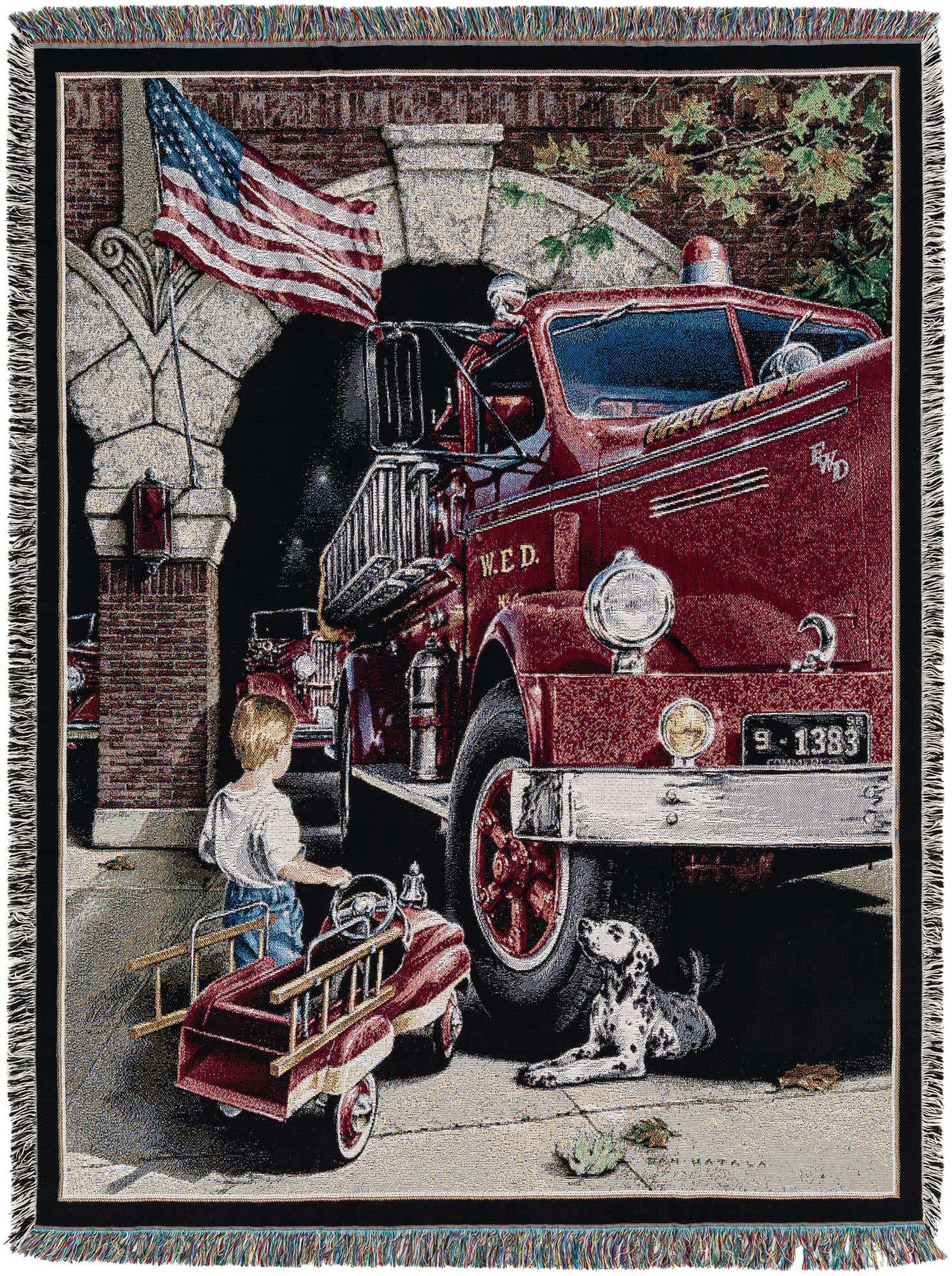 A multi-colored 4x6 rectangular throw blanket featuring a young boy with a toy fire truck, a Dalmatian dog, and a large red fire engine parked in front of a brick fire station with an American flag.
