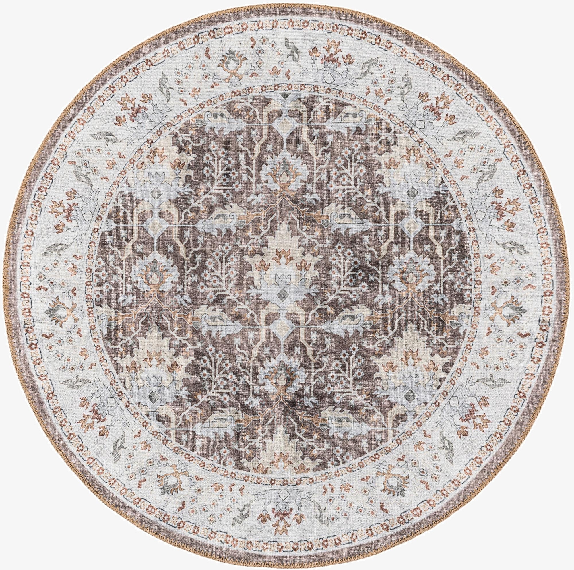 A 3' 6 round almond brown rug with a traditional medallion pattern and vintage-inspired details, featuring a flatweave texture.
