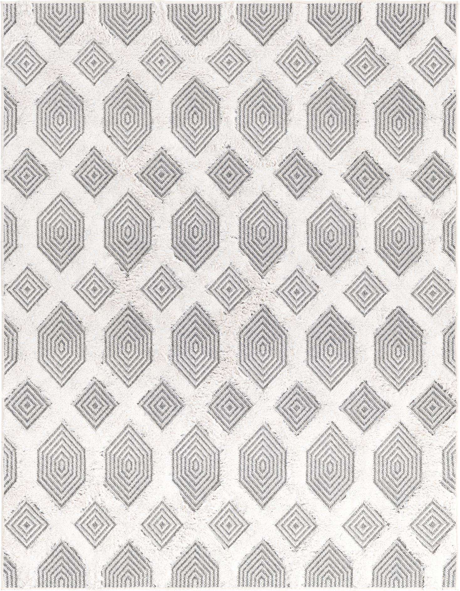 A 4x6 rectangular rug featuring a modern abstract pattern of interlocking black and gray geometric shapes on a white textured background.