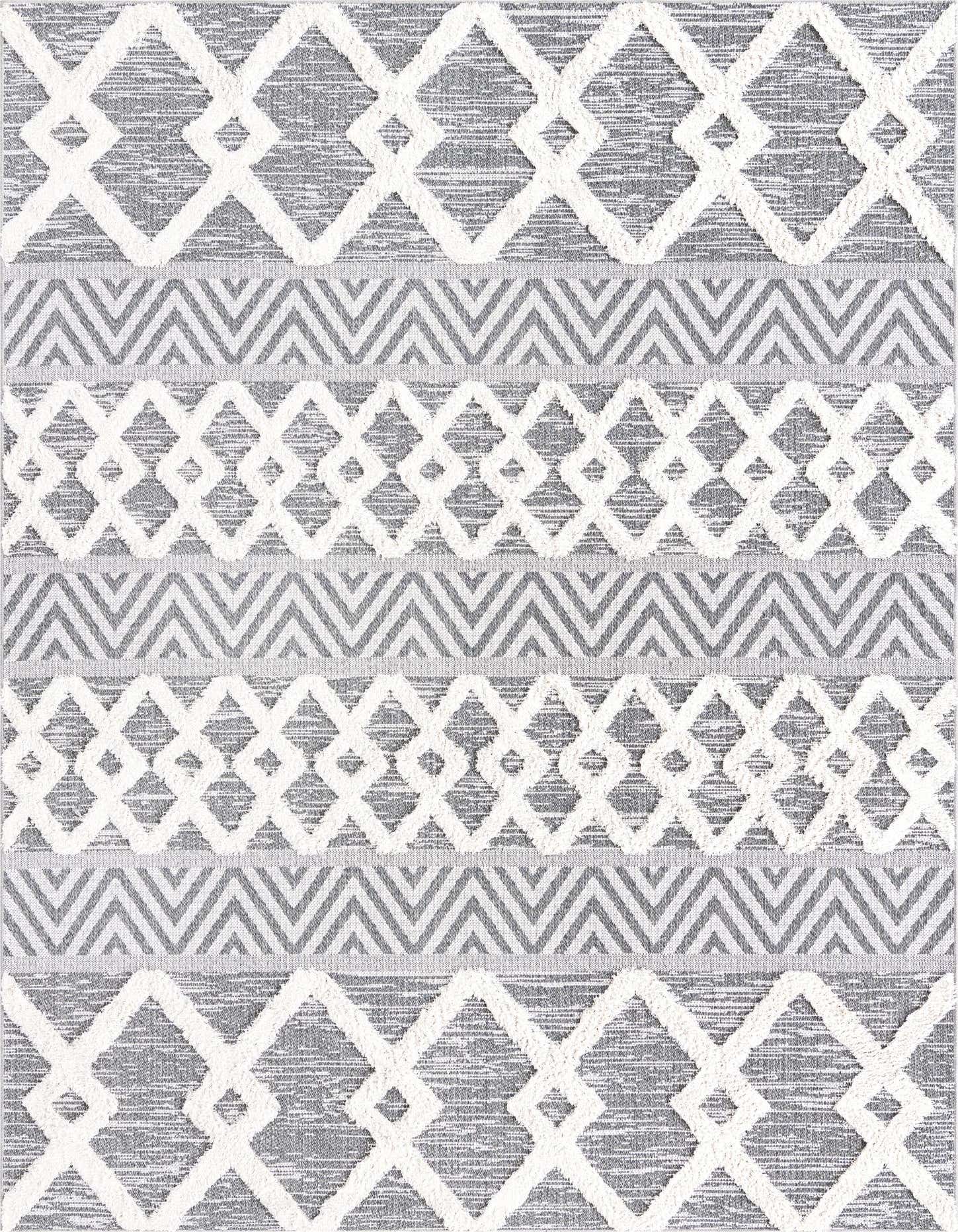 A 6x9 rectangular Rugs.com Sabrina Soto Casa rug featuring a modern tribal pattern in black and white with textured pile.