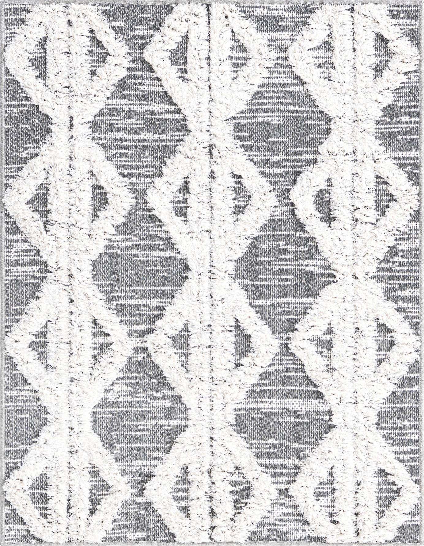 A 2x3 rectangular black and white tribal rug with a textured, high pile diamond pattern on a flatweave striped background.