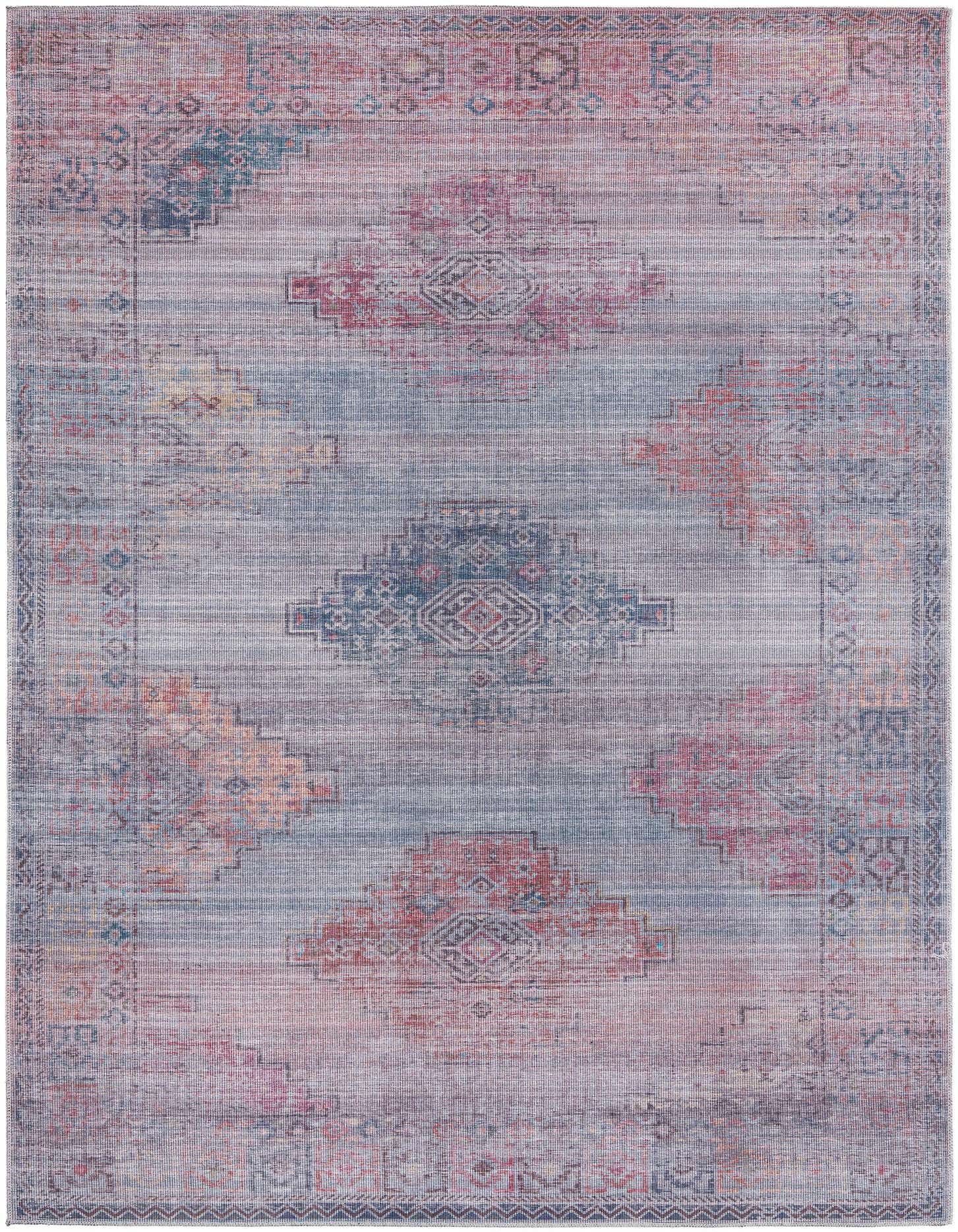 A 7x10 rectangular Sisu rug with a distressed Southwestern and tribal pattern in shades of blue, red, and orange.