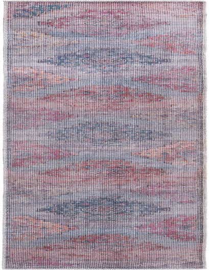 A 10 ft runner rug from the Rugs.com Sisu collection, featuring a distressed Southwestern and tribal pattern in shades of blue, red, and pink, ideal for a hallway.