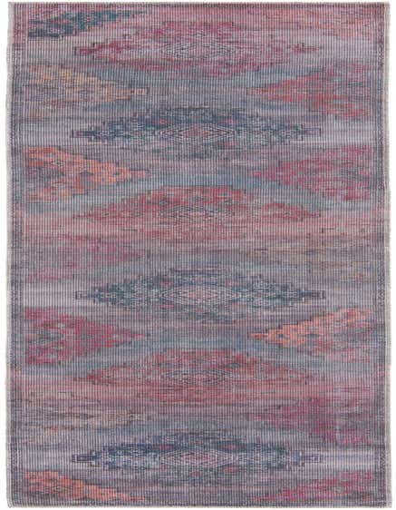 A 12 ft runner rug with a distressed Southwestern and tribal pattern in shades of blue, red, and orange.