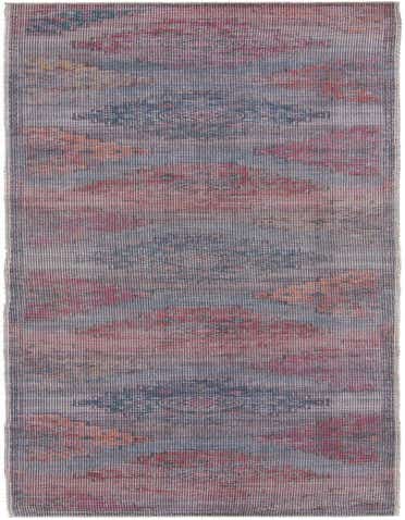 A 14 ft runner rug from the Sisu collection, featuring a faded blue, red, and orange Southwestern pattern.