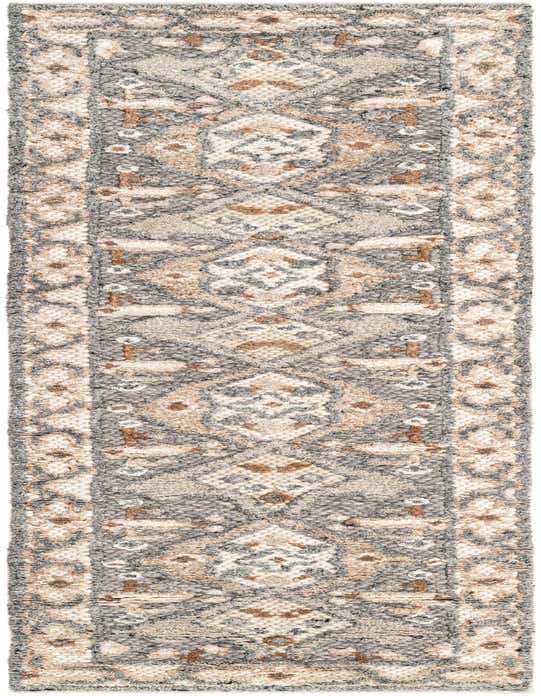 An 8 ft runner rug in antique gray with a modern geometric pattern in cream and brown, perfect for a hallway.