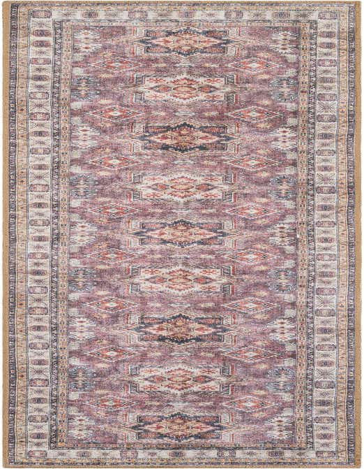 An 8 ft runner rug in antique rose pink with a distressed geometric pattern, ideal for hallways or patios.
