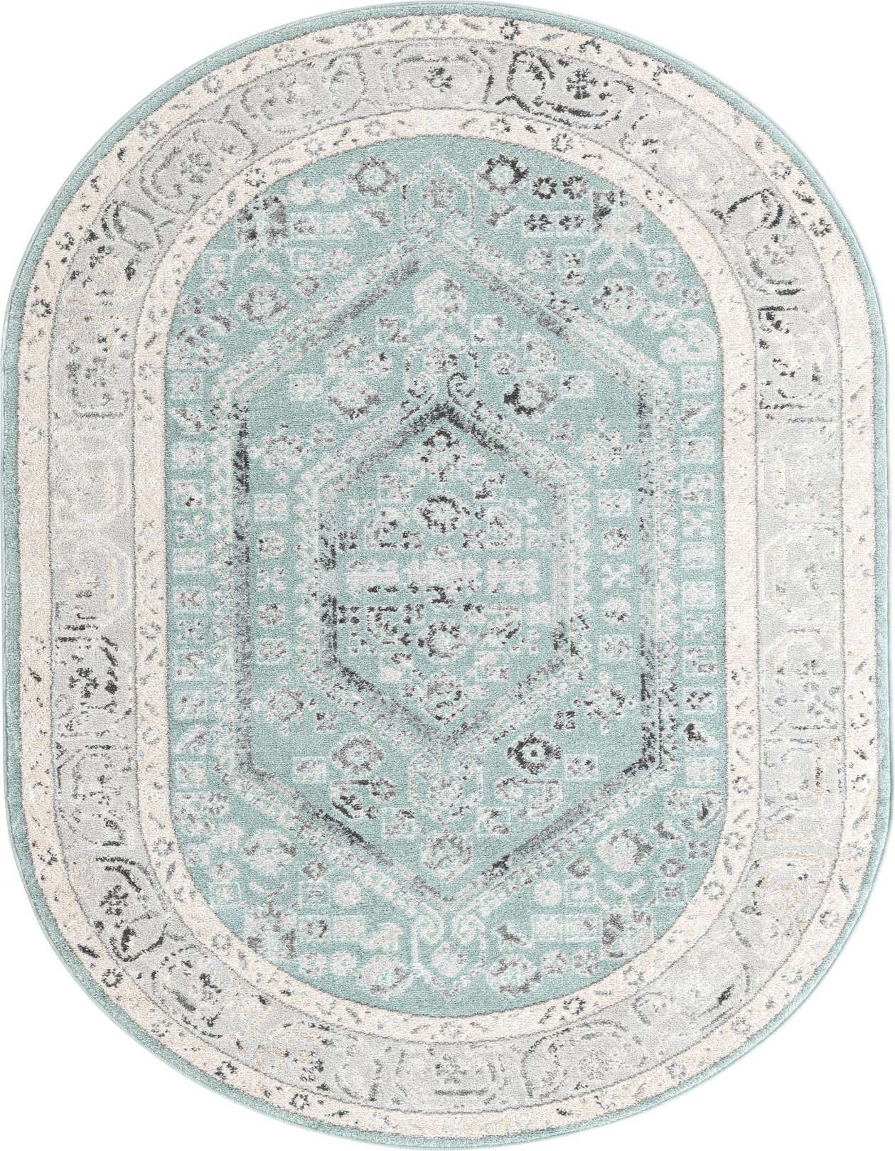 A 5'x8' oval Aurelia rug in shades of blue, grey, and cream with a distressed traditional medallion and tribal pattern.