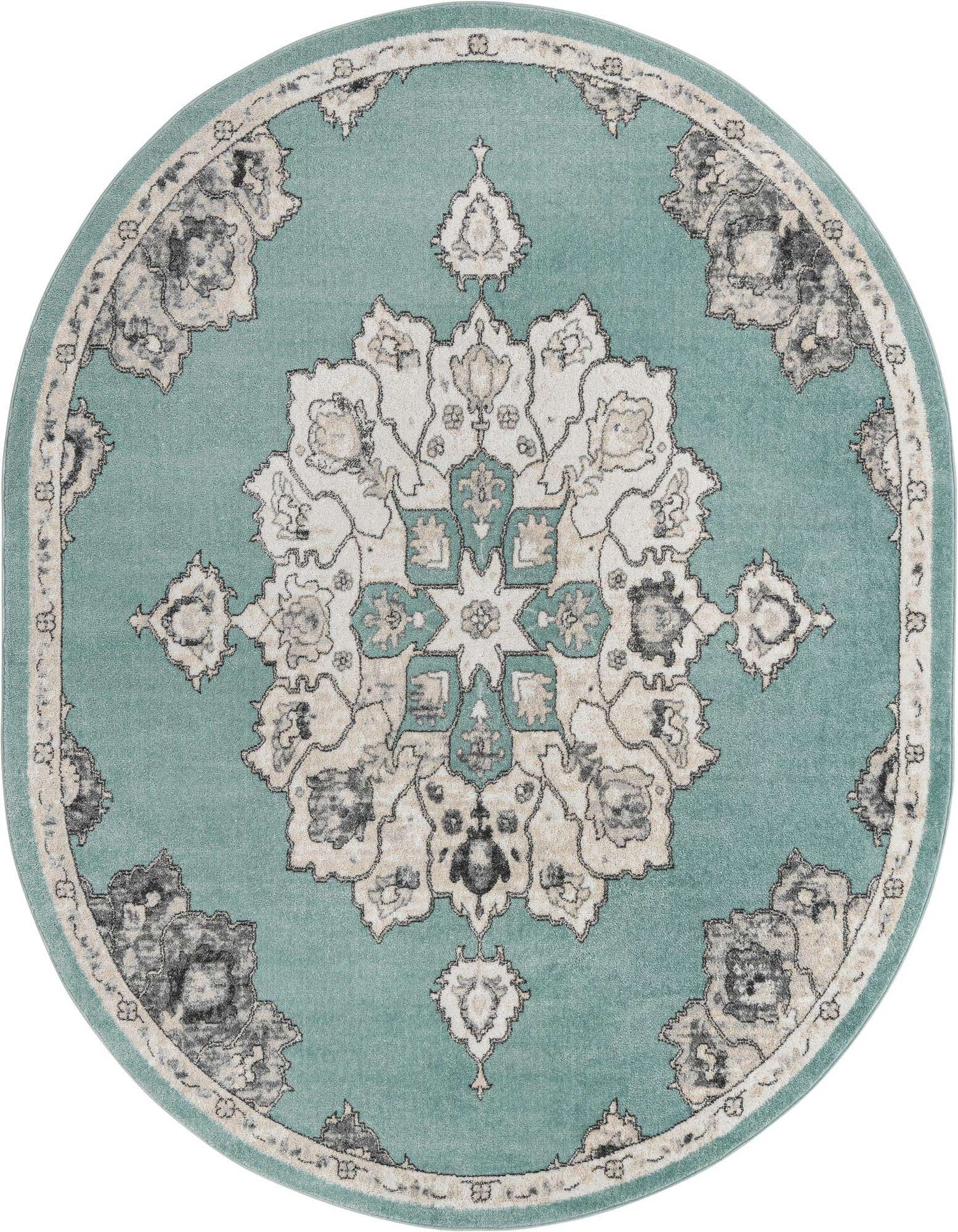An oval blue rug with a large central medallion and botanical patterns in cream, grey, and teal, featuring a thin pile.